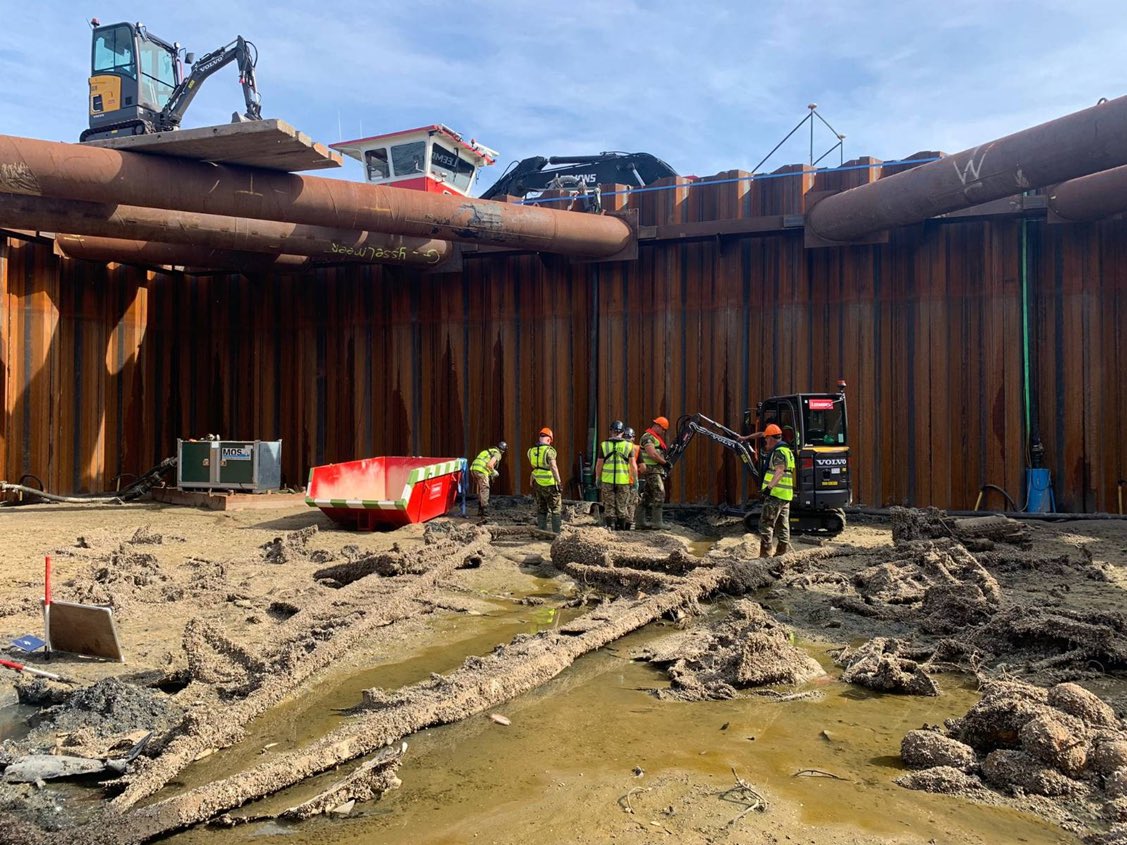 Members of the team recovering parts of the Lancaster from inside the cofferdam