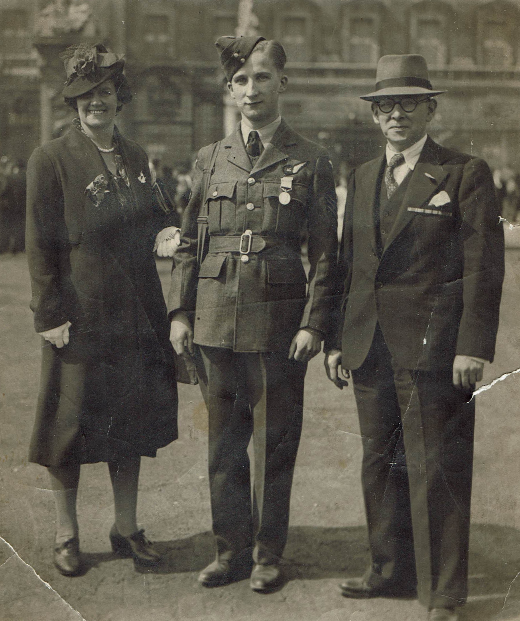 Black and white photo of Flight Sergeant Moore with his parents