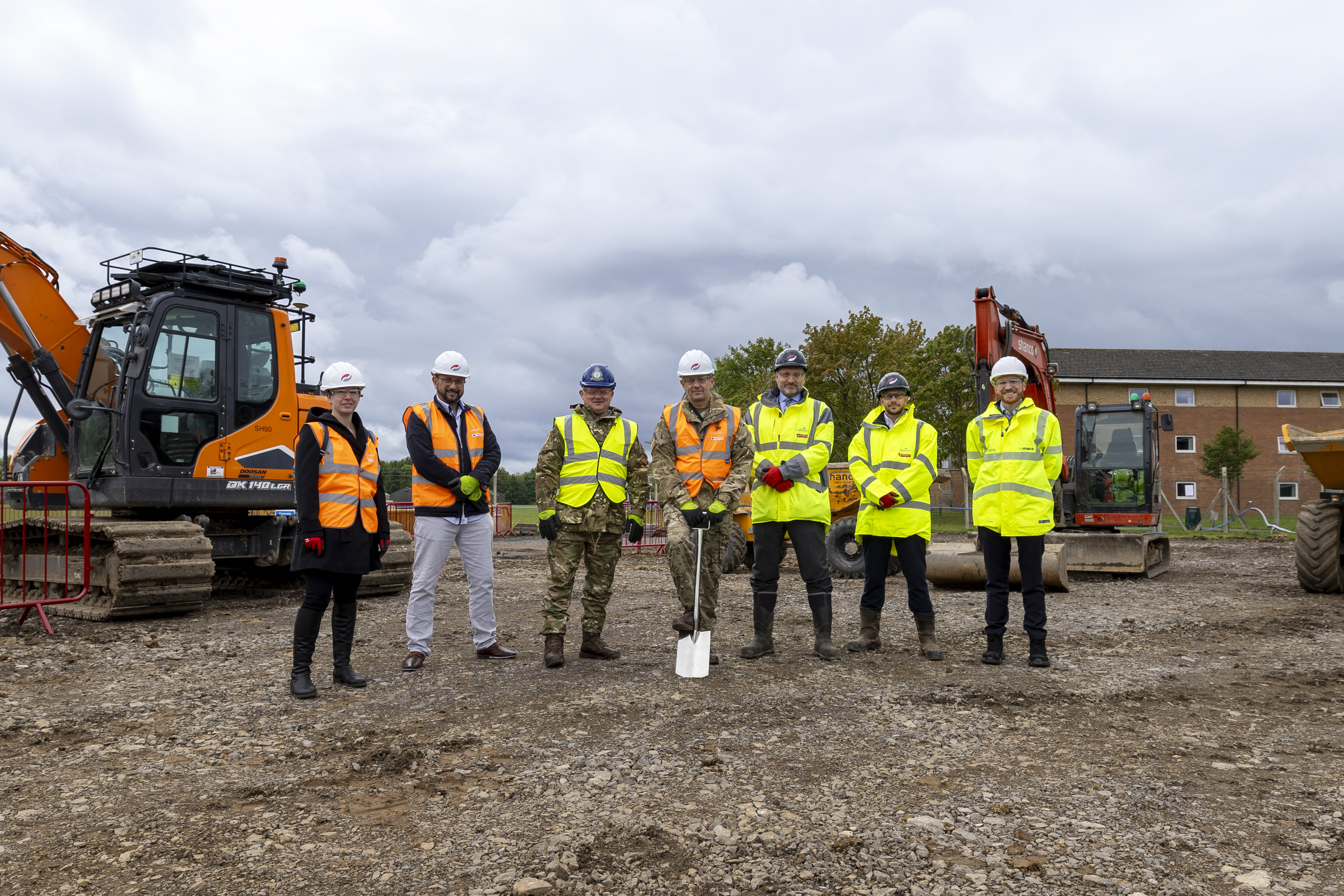 Group of men take part in ground-breaking ceremony