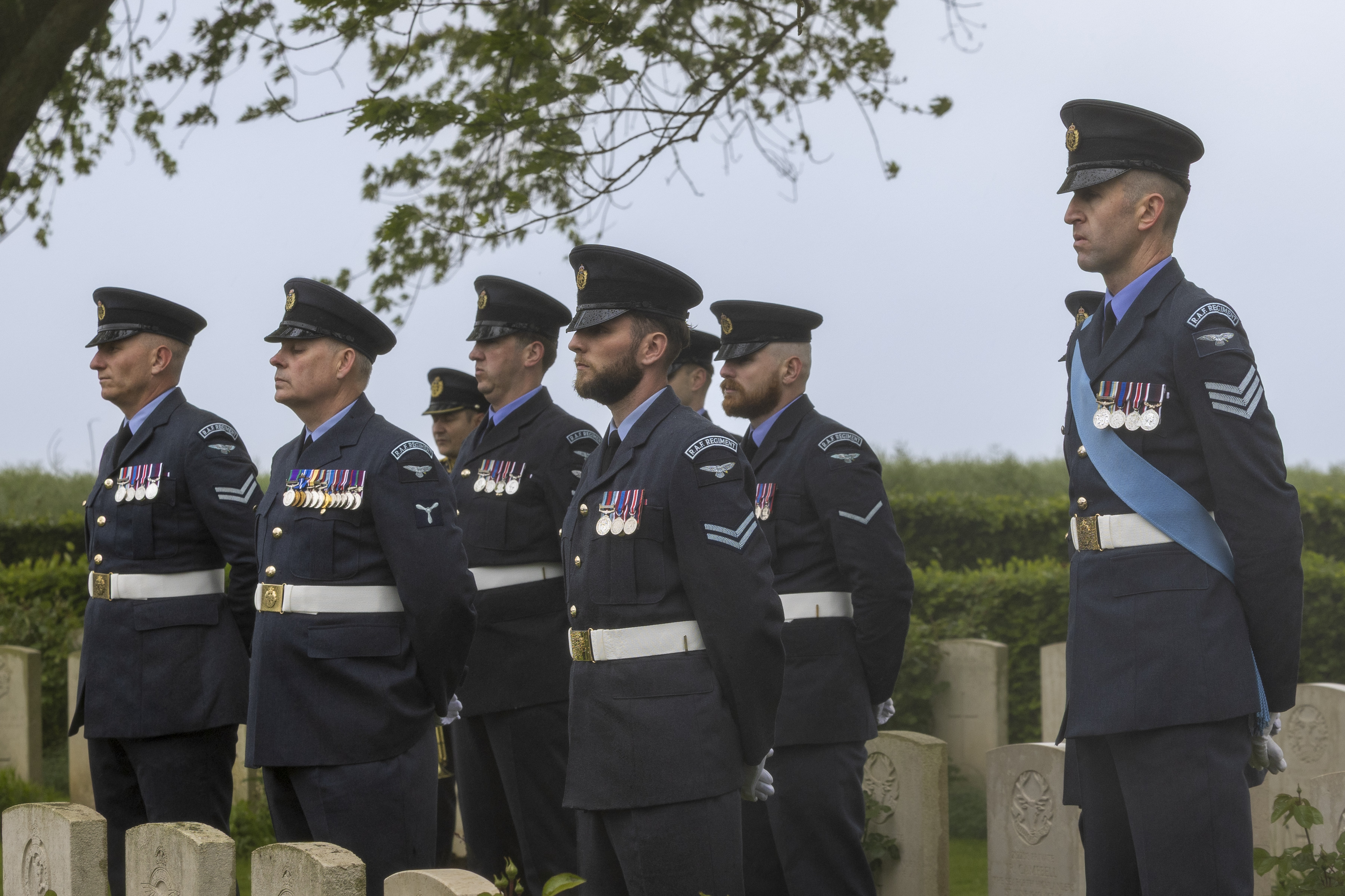 Coffin bearers at the graveside of Sqn Ldr Fidler
