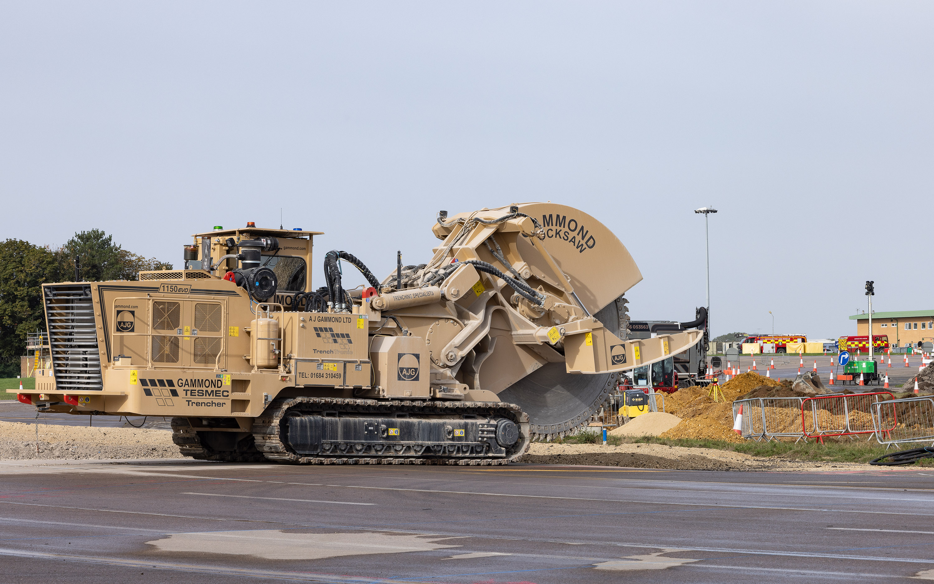 A large construction vehicle in use for resurfacing work at RAF Brize Norton's runway.