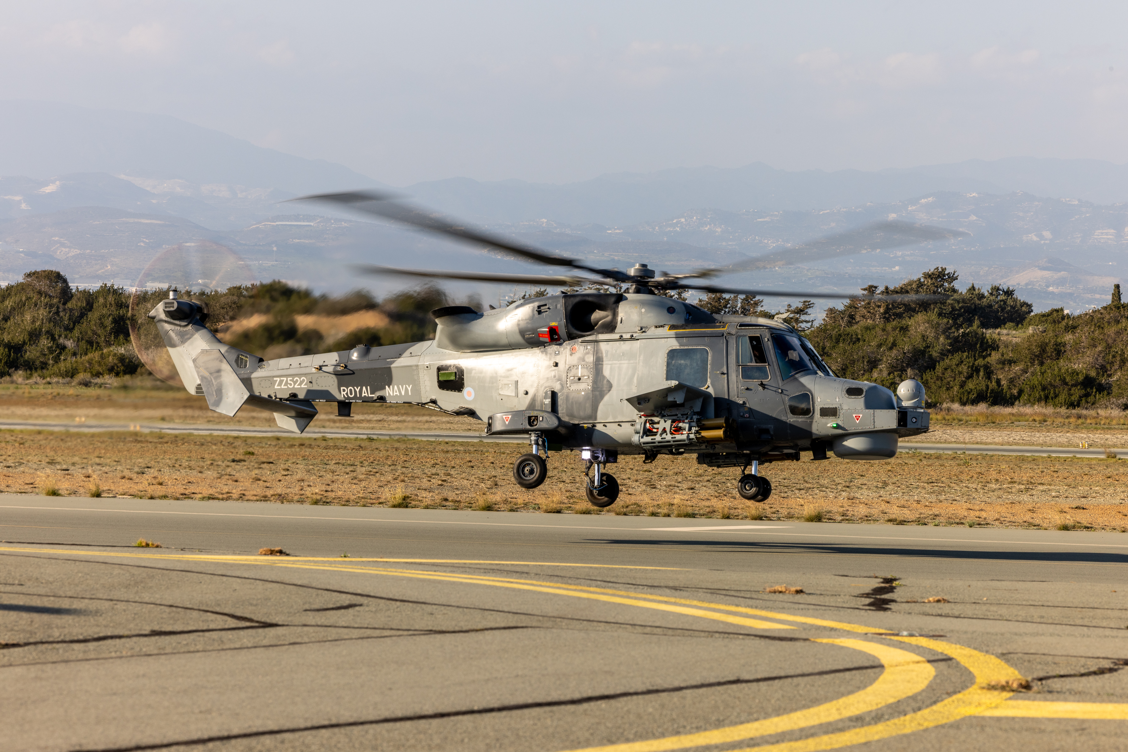 A Royal Navy Wildcat helicopter taking off.