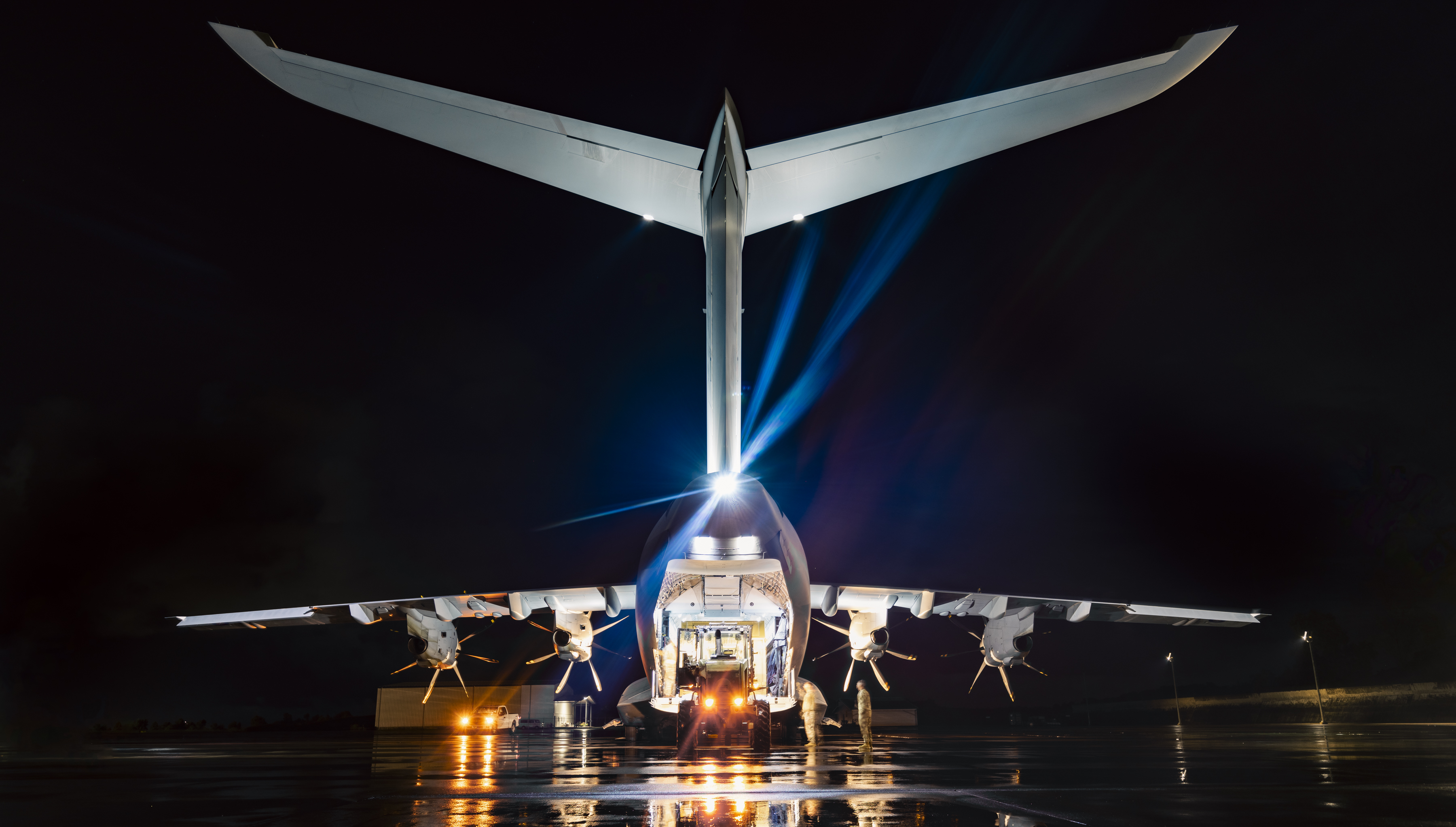 A400M lit up on runway being loaded with kit