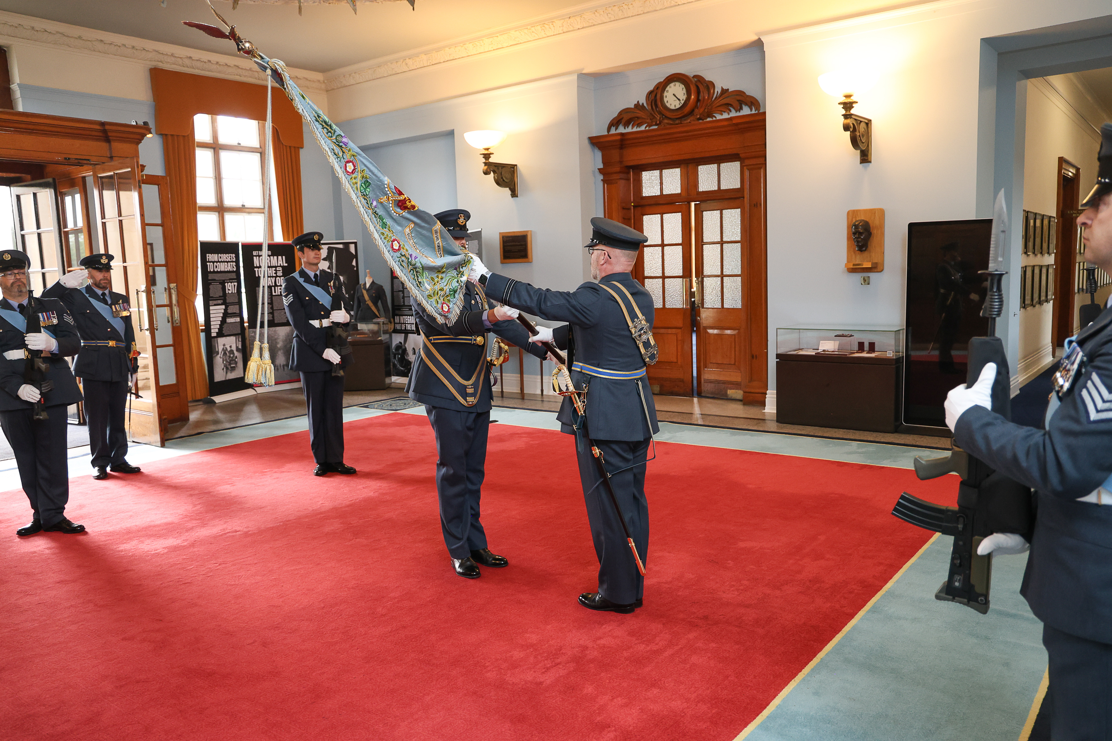 Number 47 Squadron standard is handed over and saluted