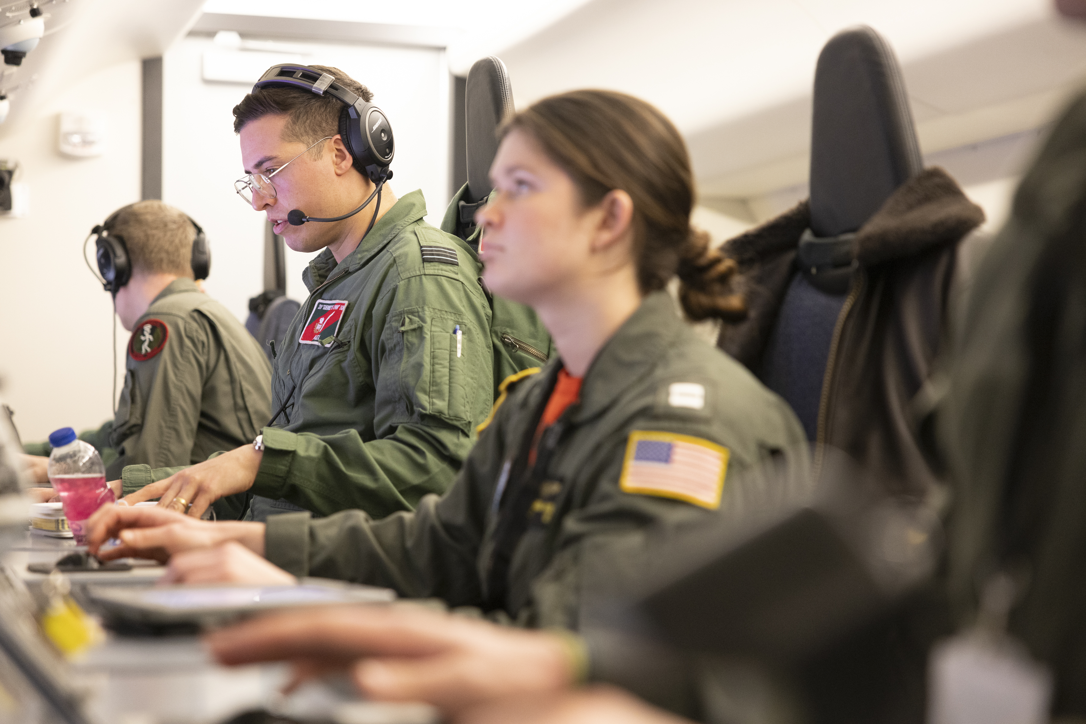 Poseidon crews at their workstation on board the aircraft.