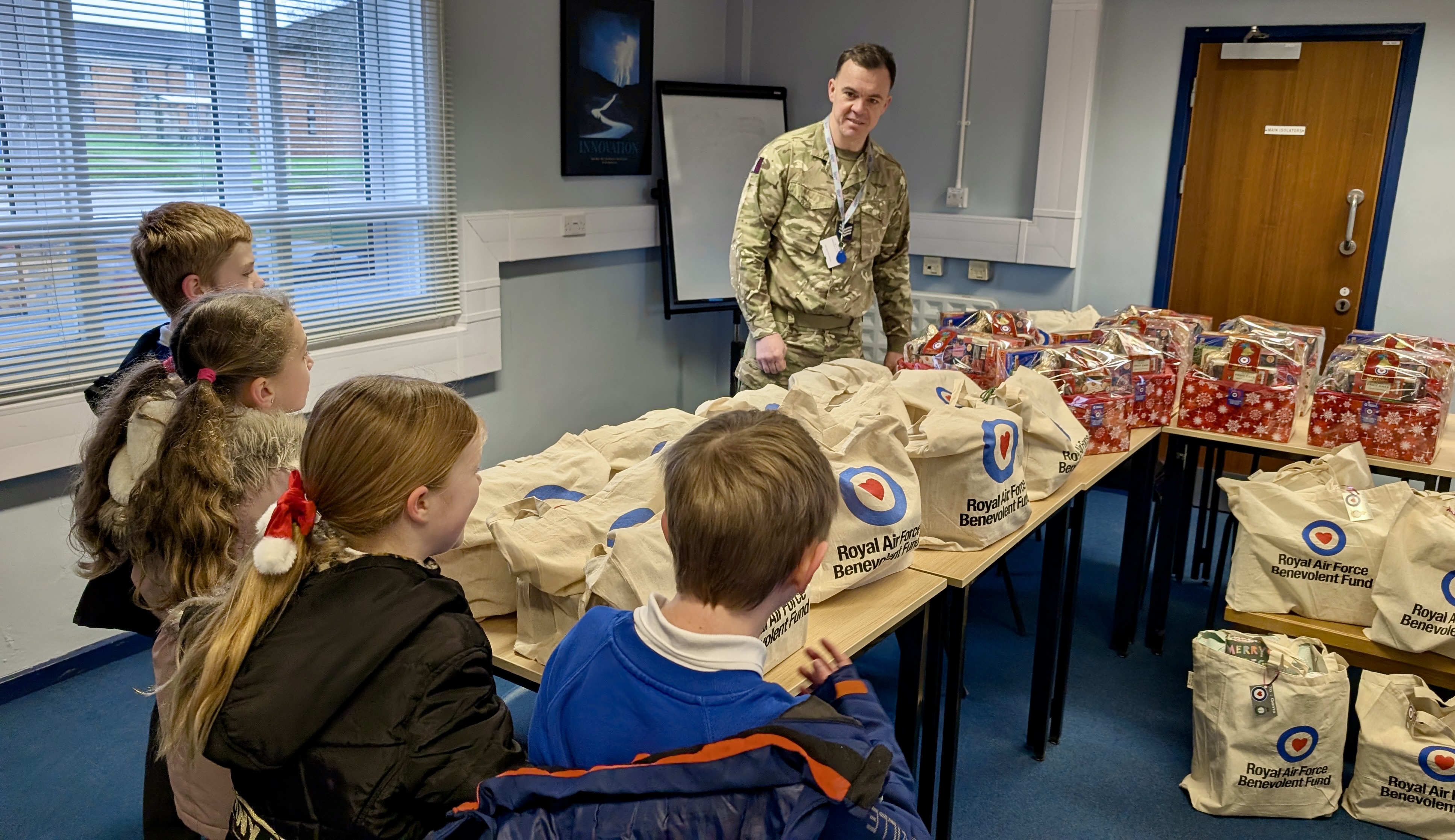 Children from RAF Leeming County Primary School with the hampers for veterans