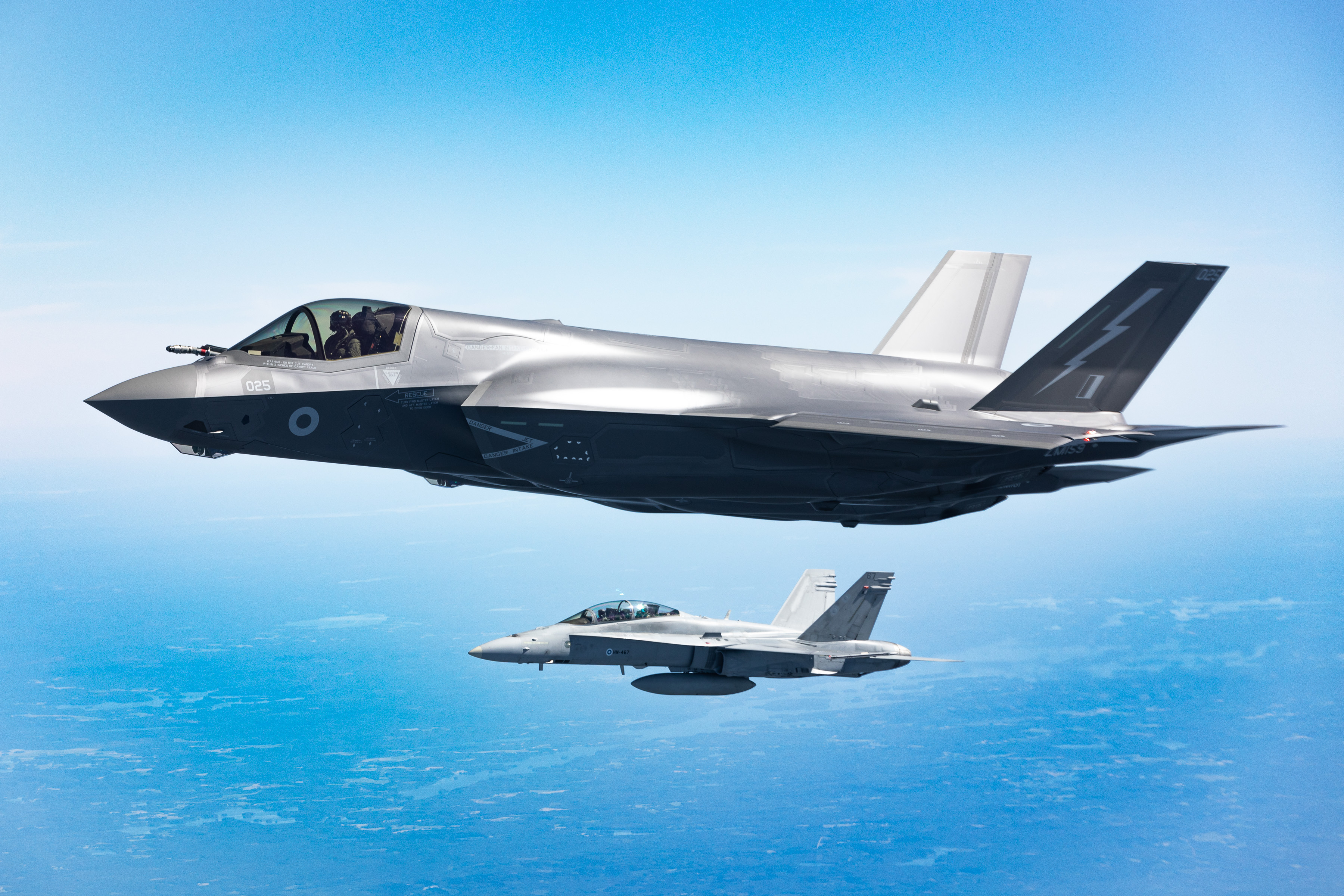 F35 flying with another aircraft