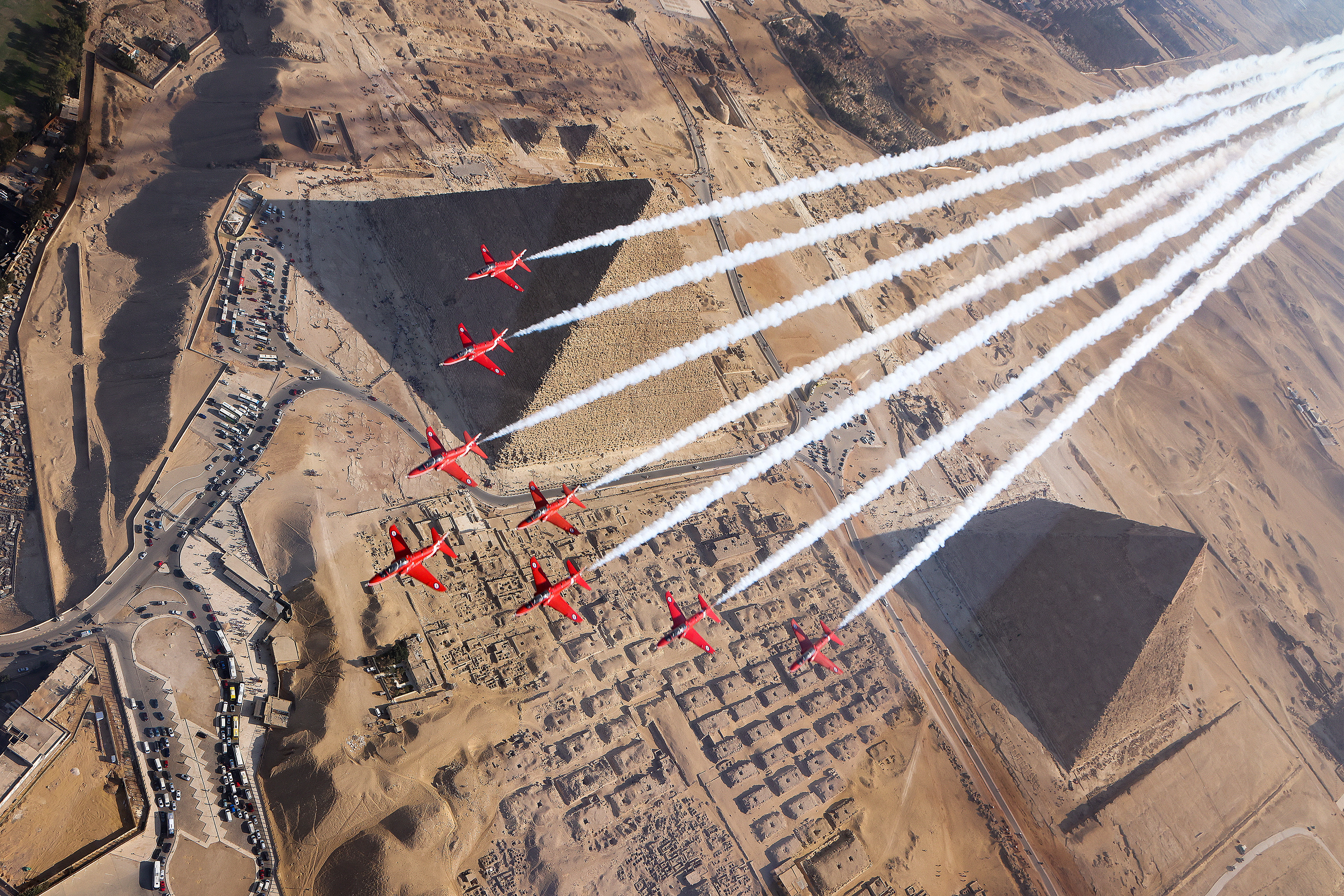 Red arrows flying over the pyramids