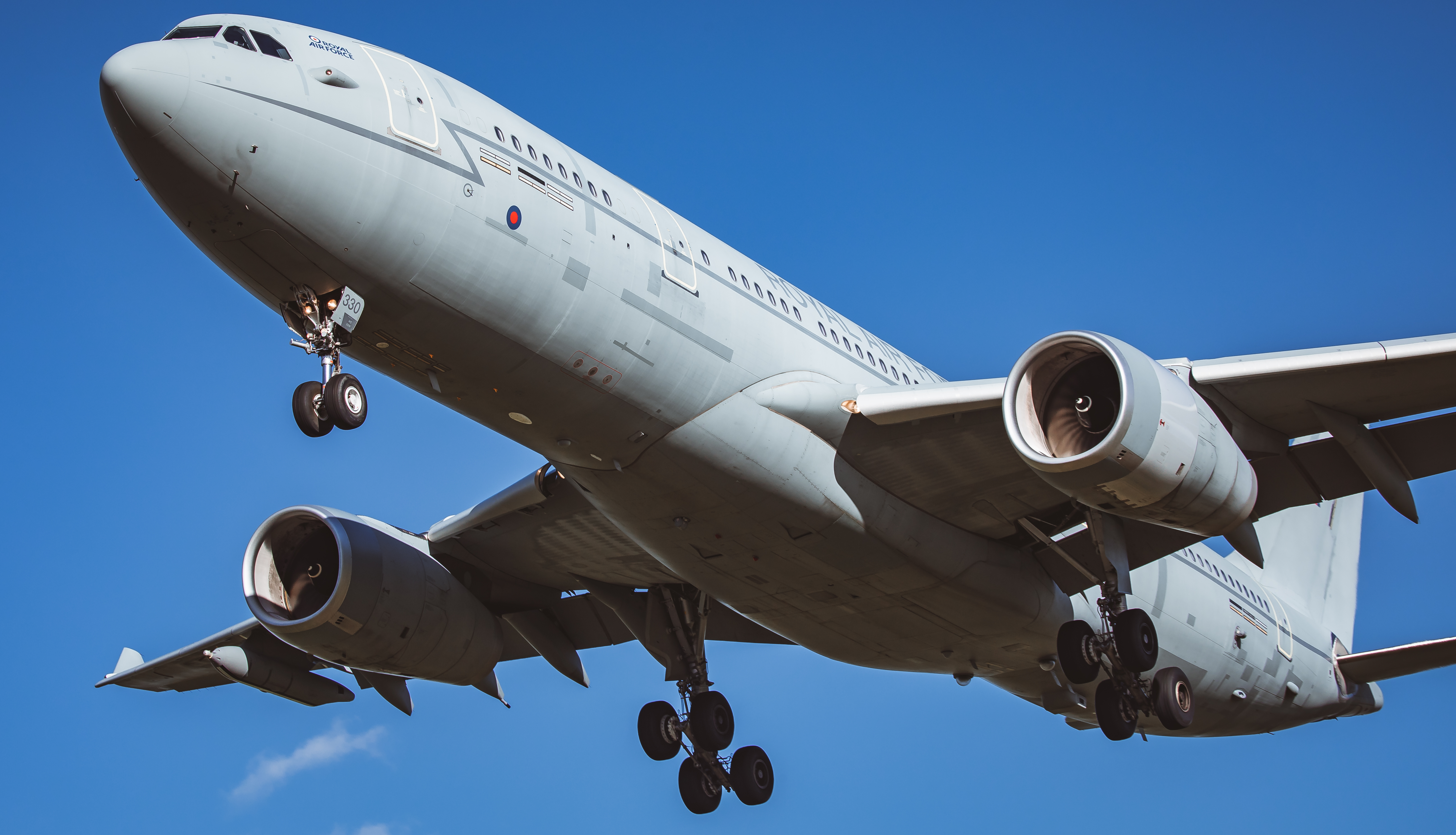 An RAF Voyager in flight through blue skies.