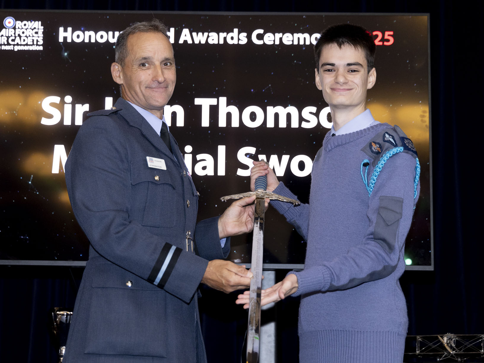CWO Dedman receiving the Sir John Thomson Memorial Sword from Commandant RAFAC 