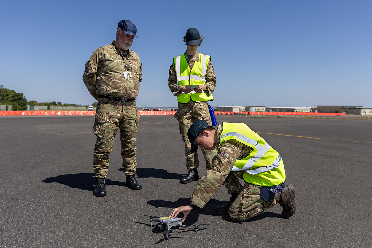 Cadet setting up a drone before flight