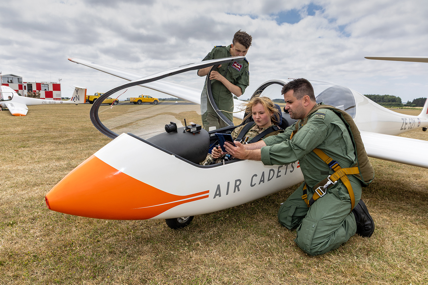 Gliding instructor briefing a cadet in a Viking glider