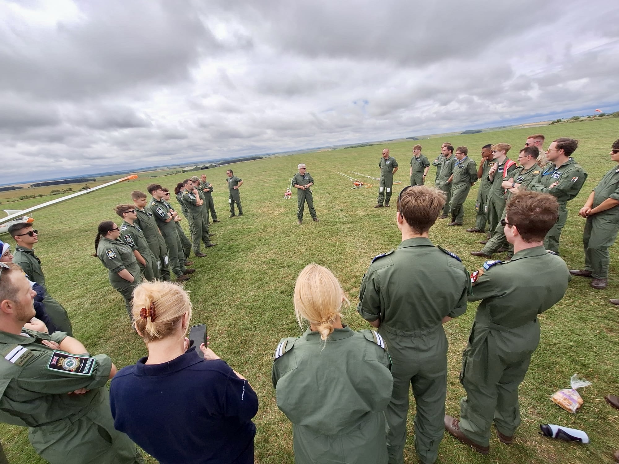 Adult volunteers gather for a briefing