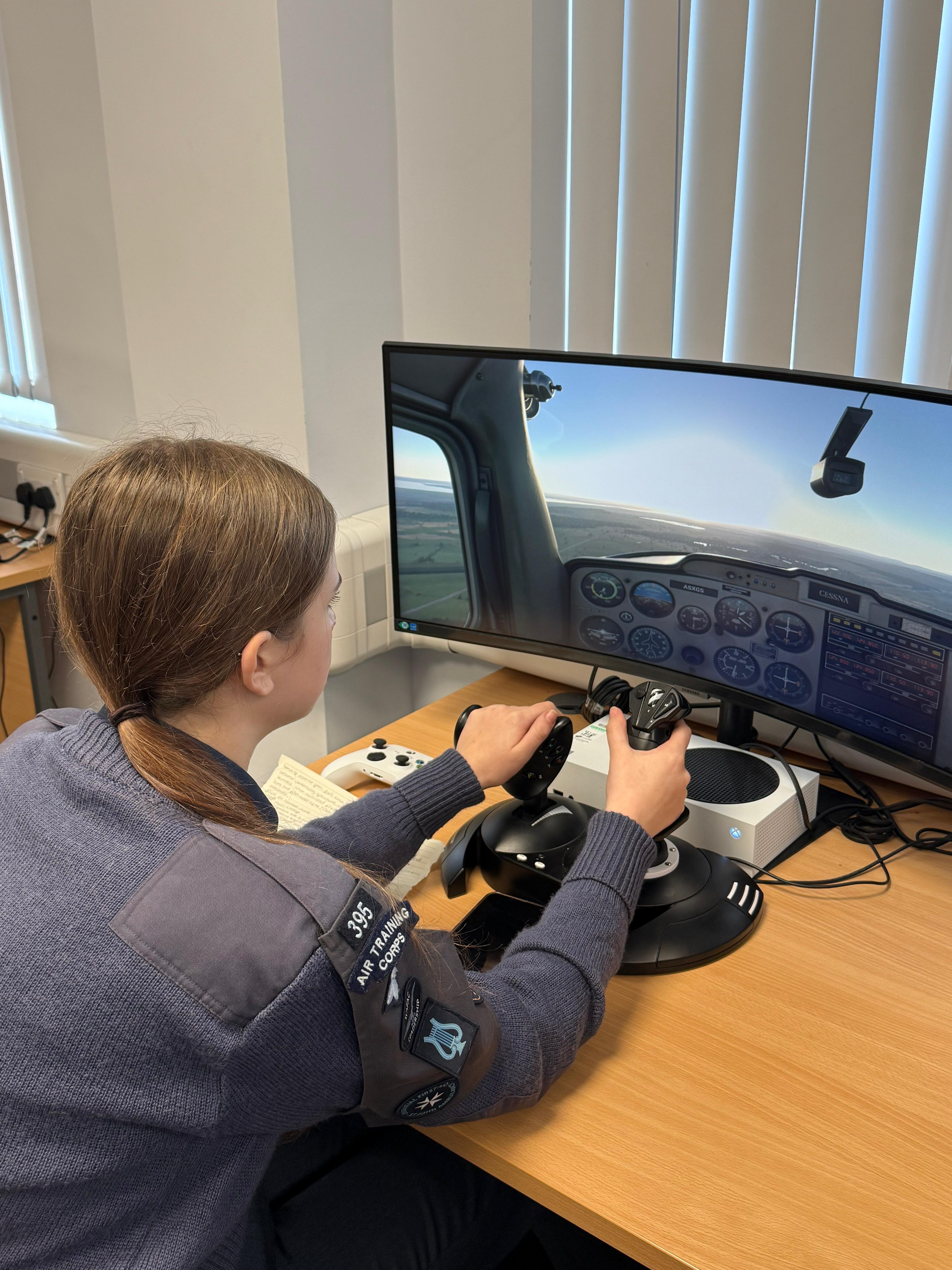 cadet on computer flight simulator