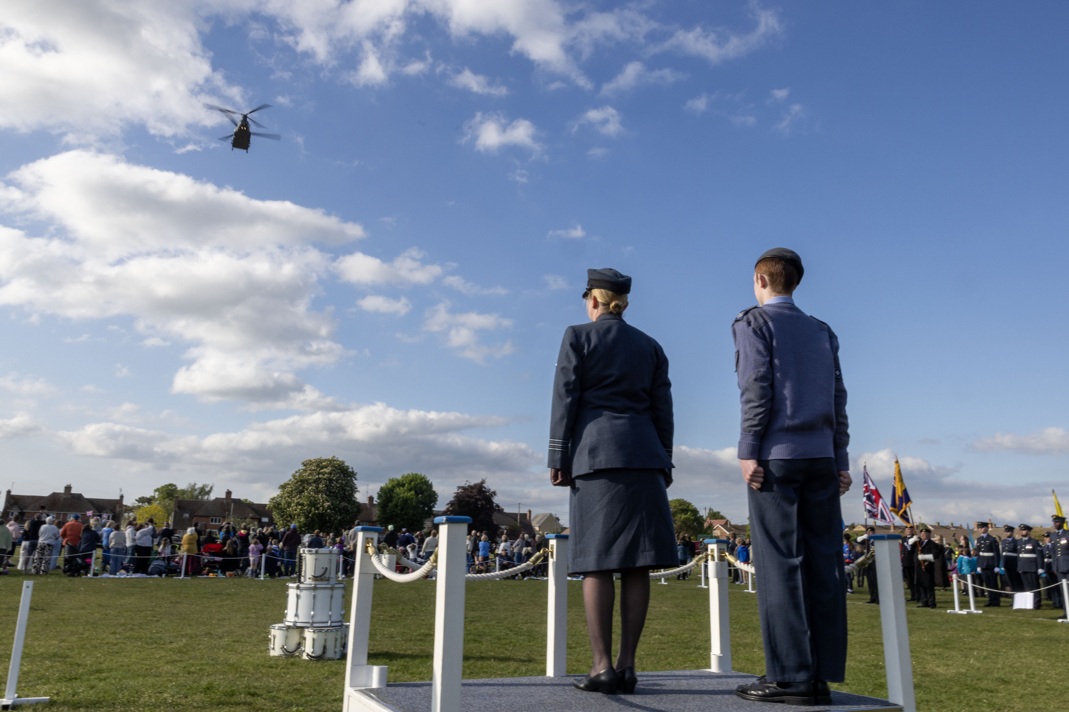 28 Sqn Chinook flying over a hollow square formed around a field alter. 