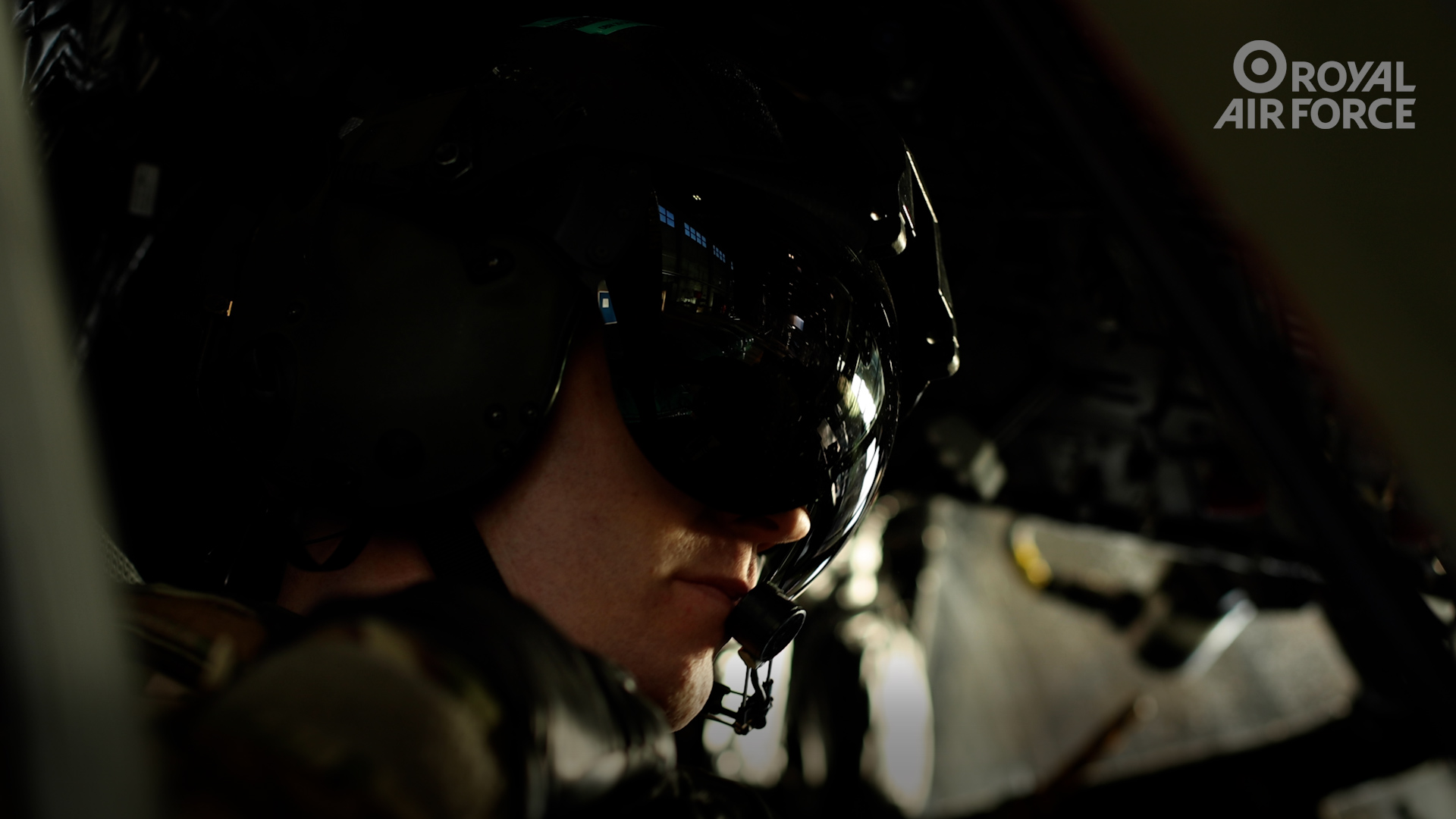 Royal Air Force pilot wearing a flying helmet. 