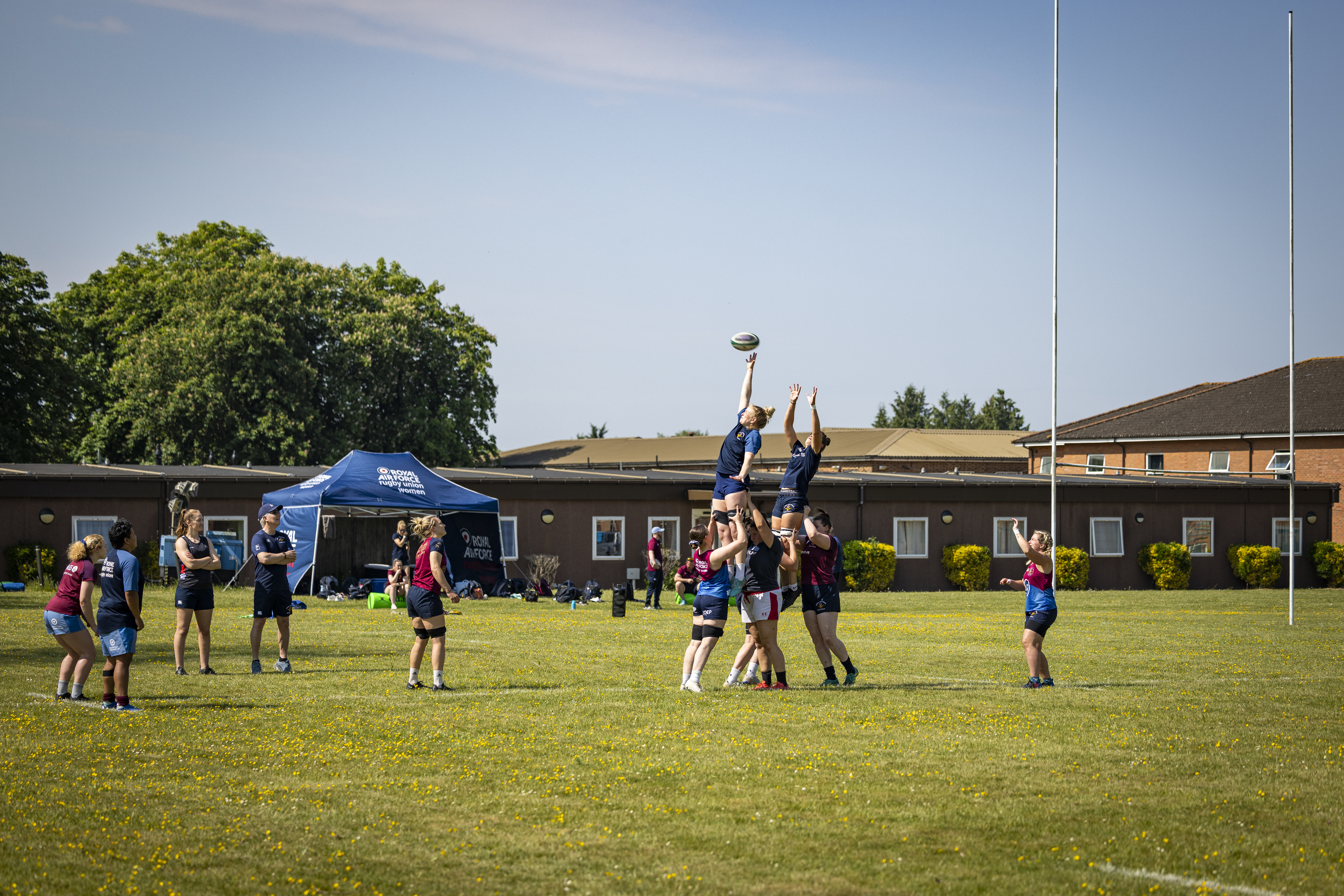 RAF Rugby Union Women's team players practice line-out drills.