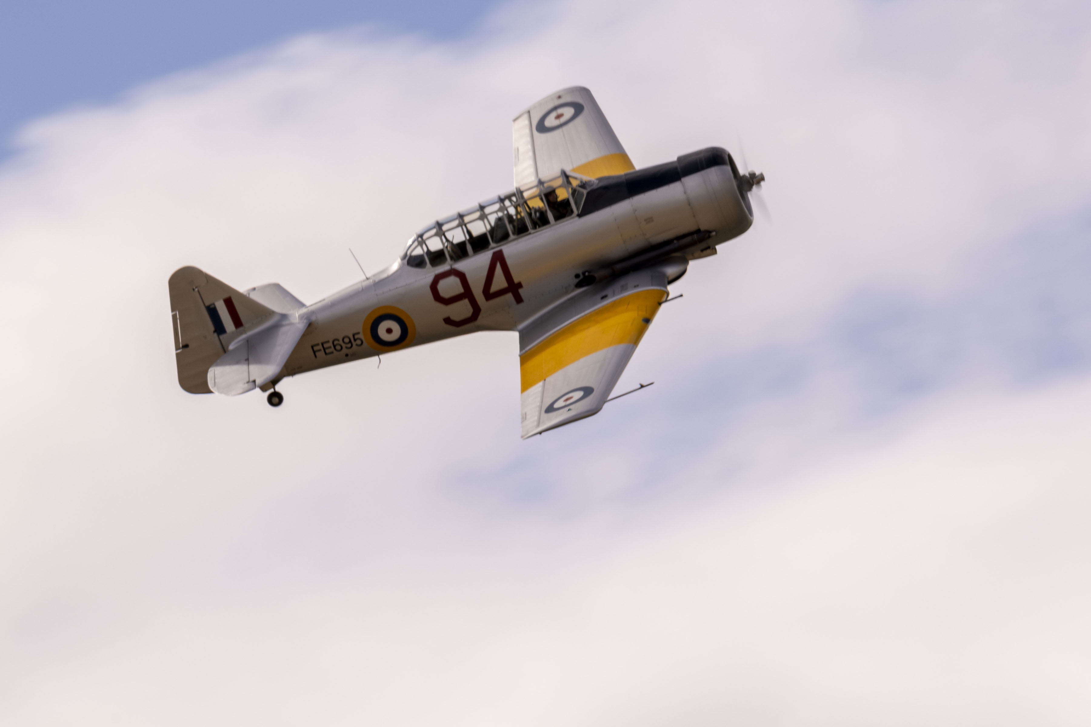 Harvard aircraft angled towards viewer during flying display. 
