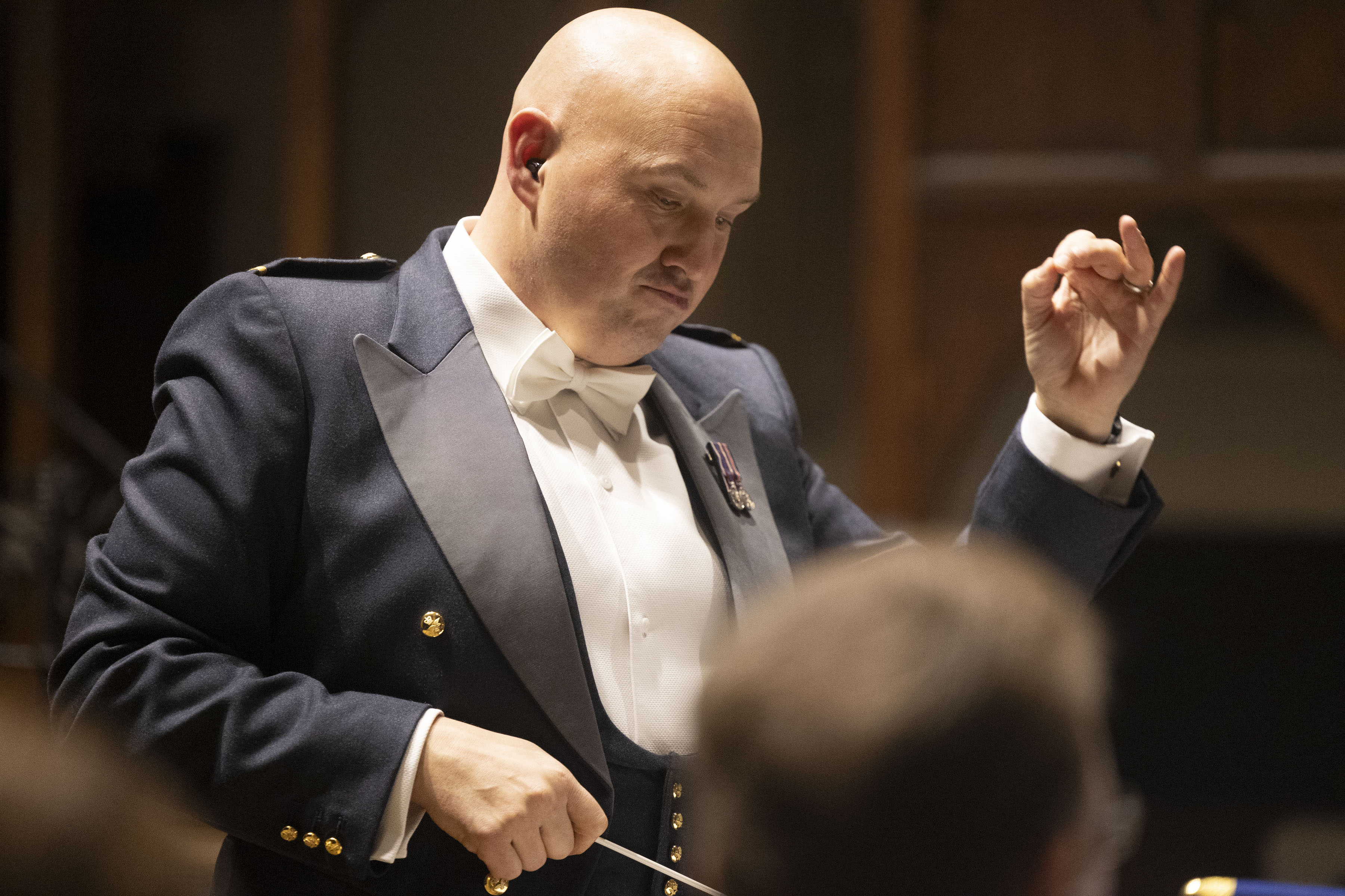 Fg Off Howley conducting the Band of the RAF Regiment at Dorchester Abbey.