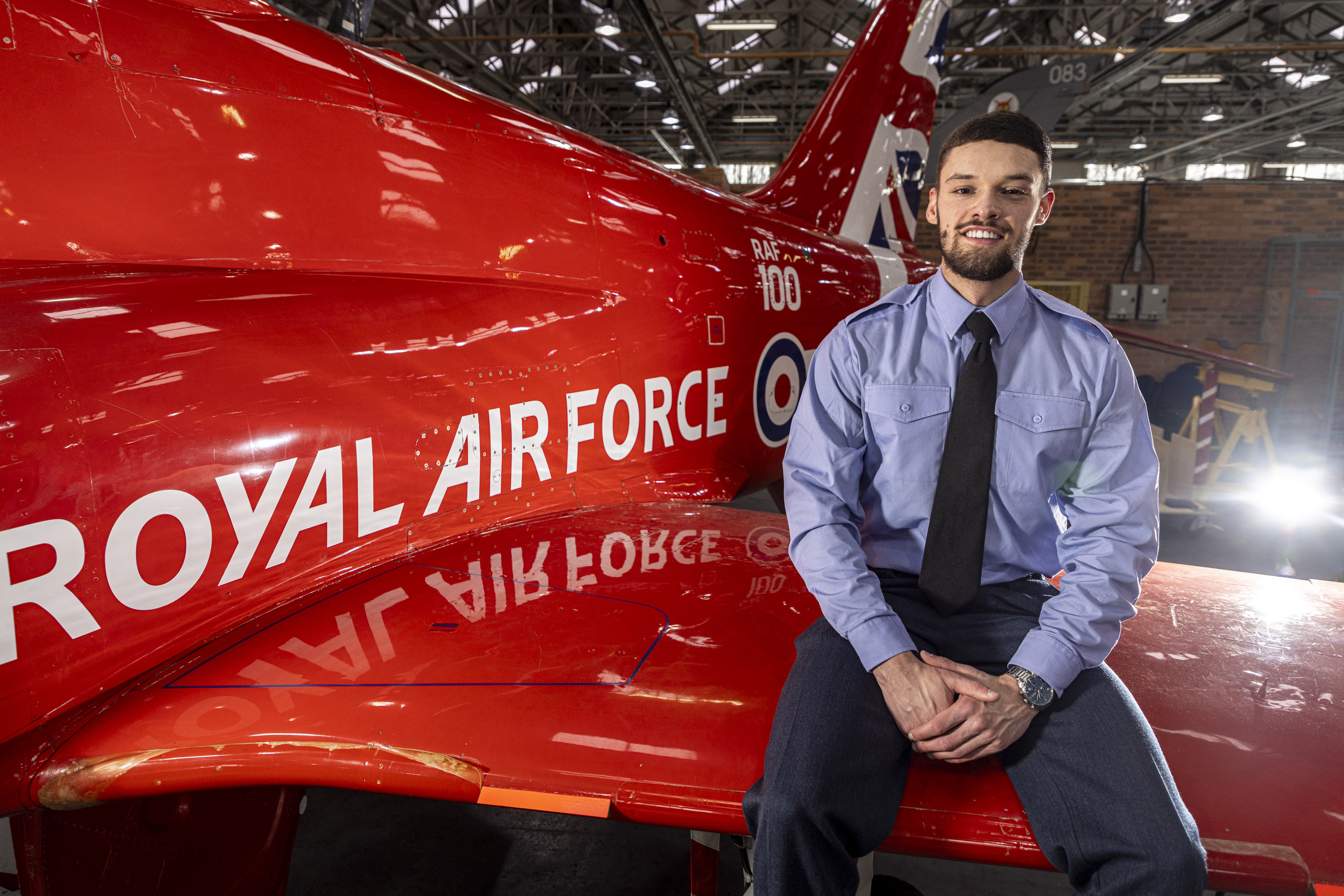 AR Pawson is sitting on the wing of the RAFAT Hawk within No.1School of Technical Training