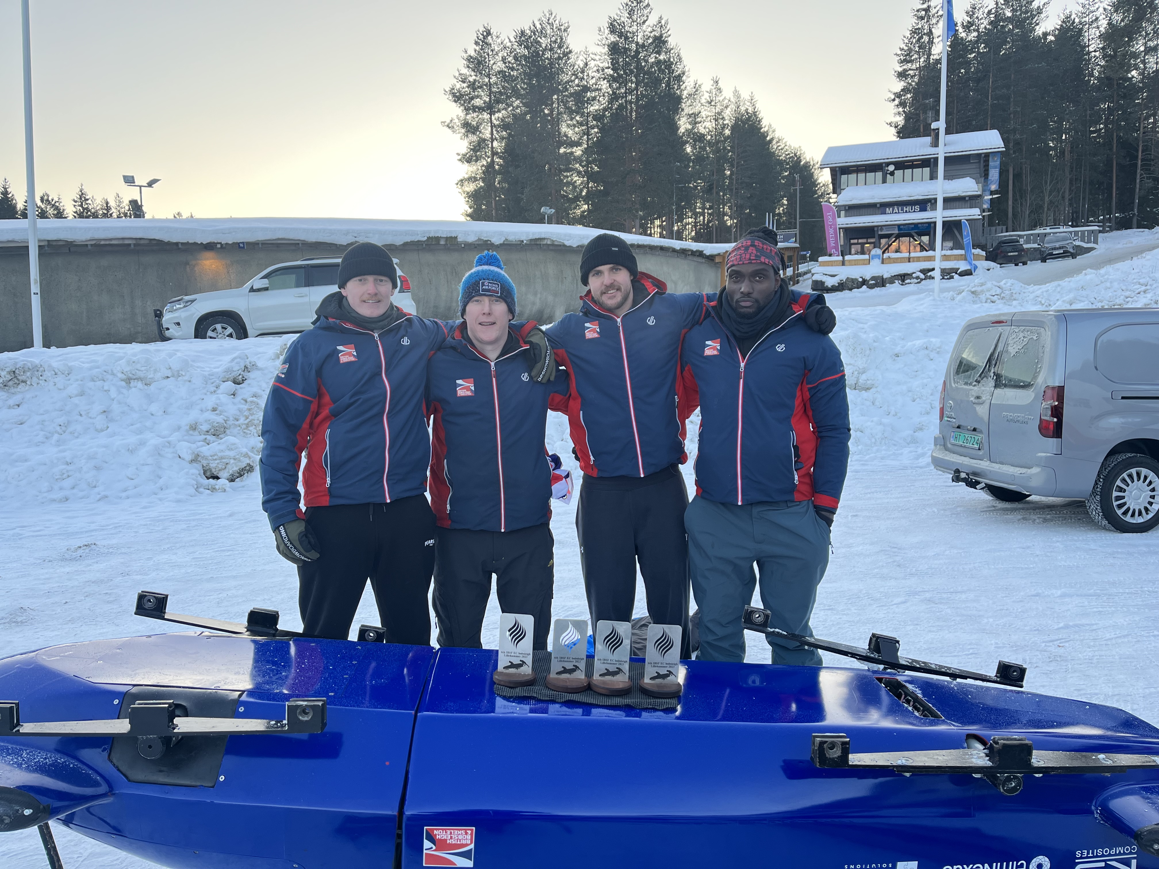 Bobsleigh 4-man team with trophies
