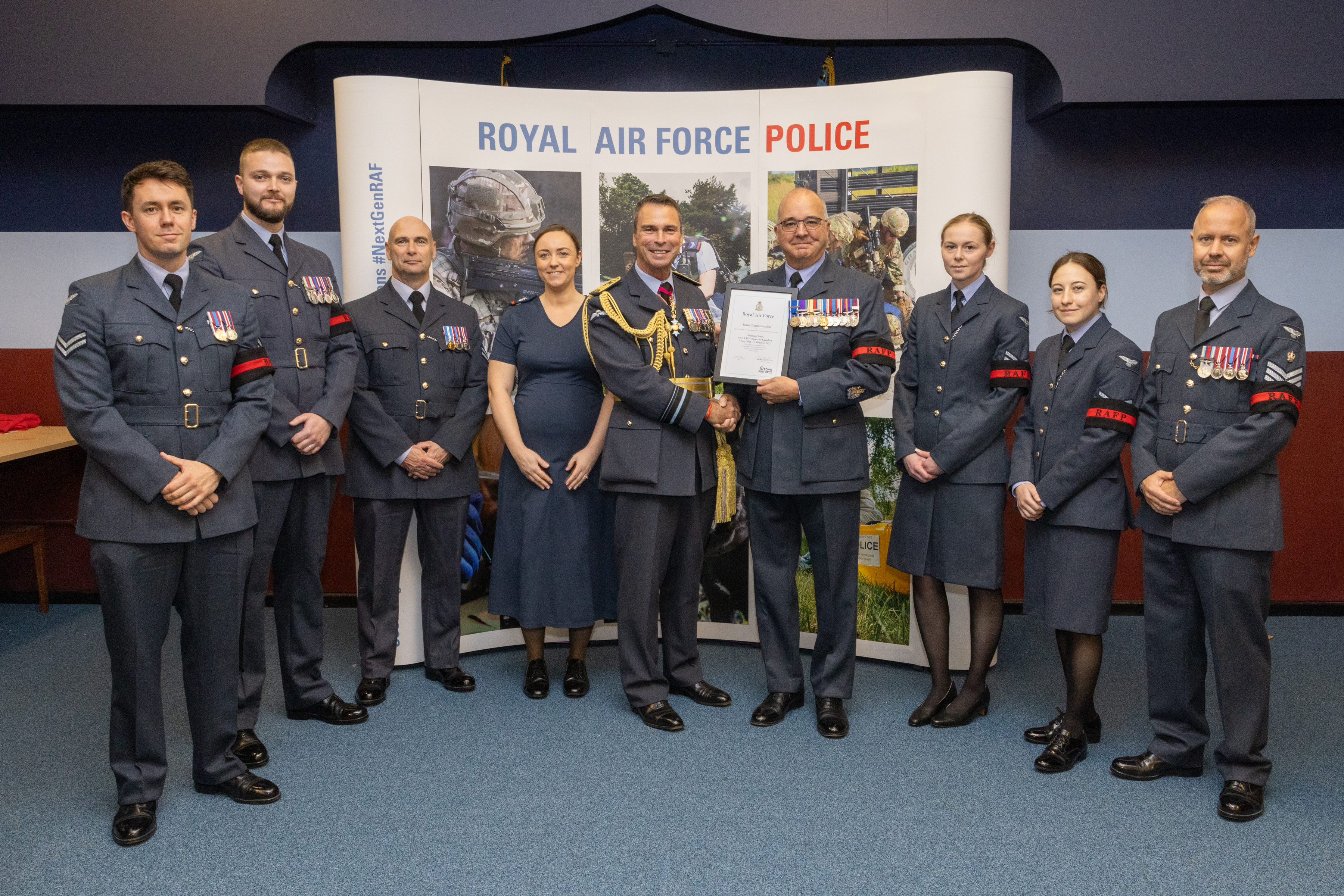 Air Vice Marshal Munro presenting a Director Reserves Team Commendation to the 3PS Training Team
