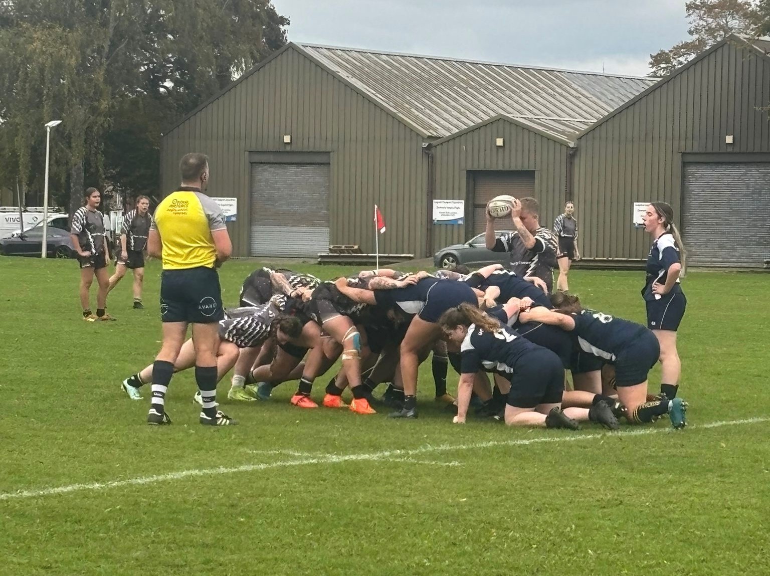 The teams engaging in a scrum