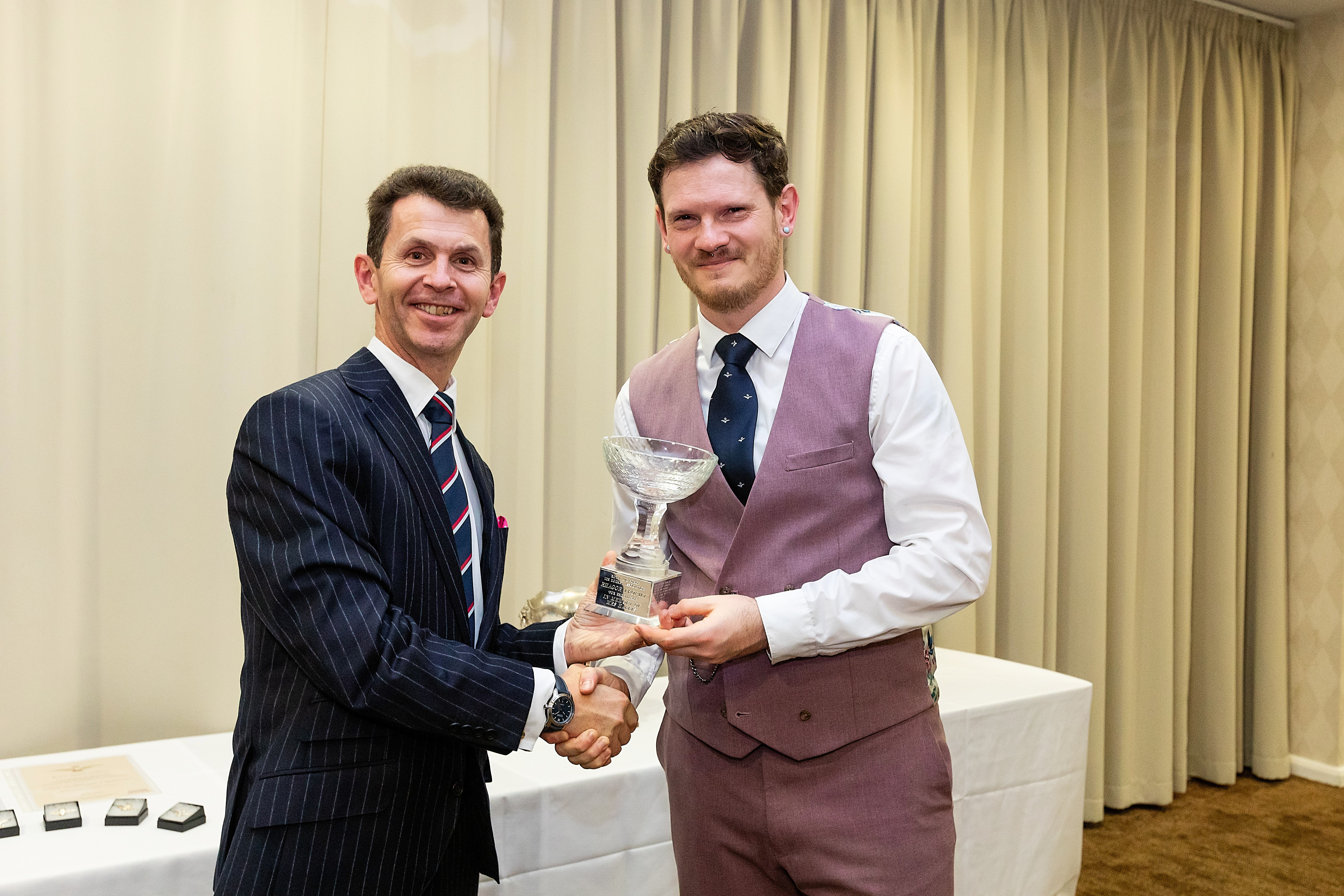 Corporal Young accepting the Rhagor Trophy from Air Commodore Hunt, President of the RAF Ice Hockey Association 