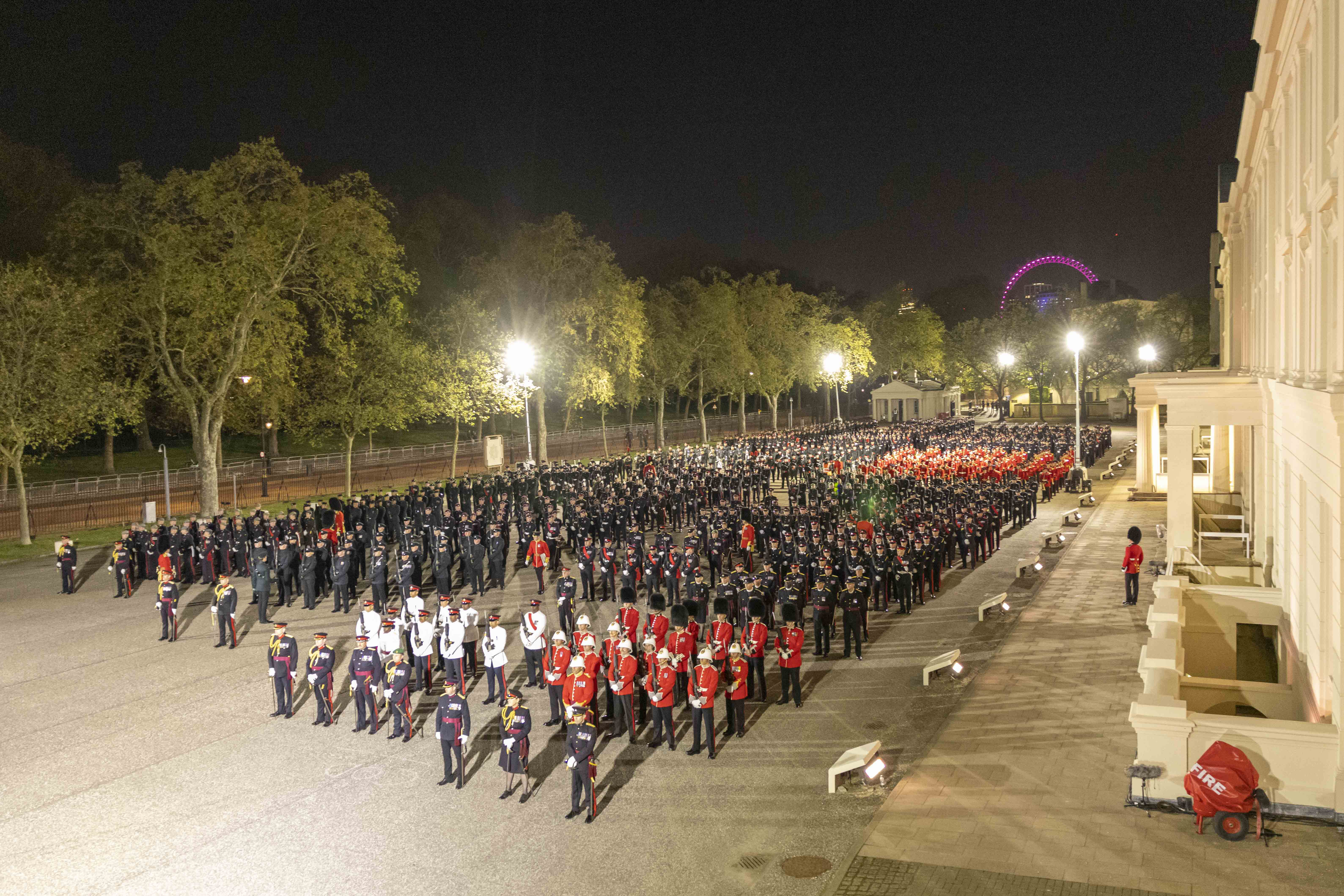 Formed up outside Wellington Barracks, the 7,000 strong parade waits in anticipation to begin rehearsing through the night.