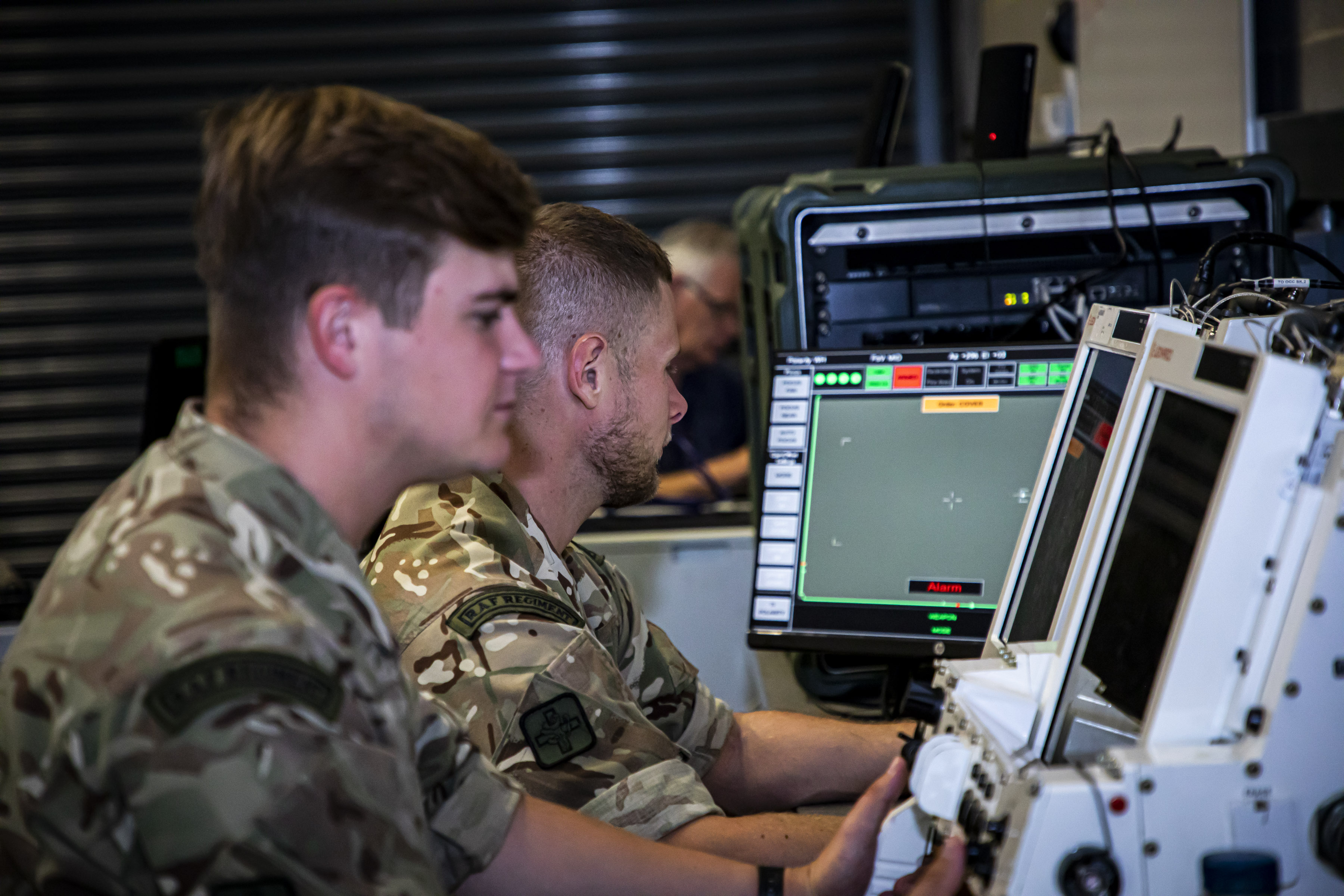 RAF Regiment C-UAS personnel working at screens.