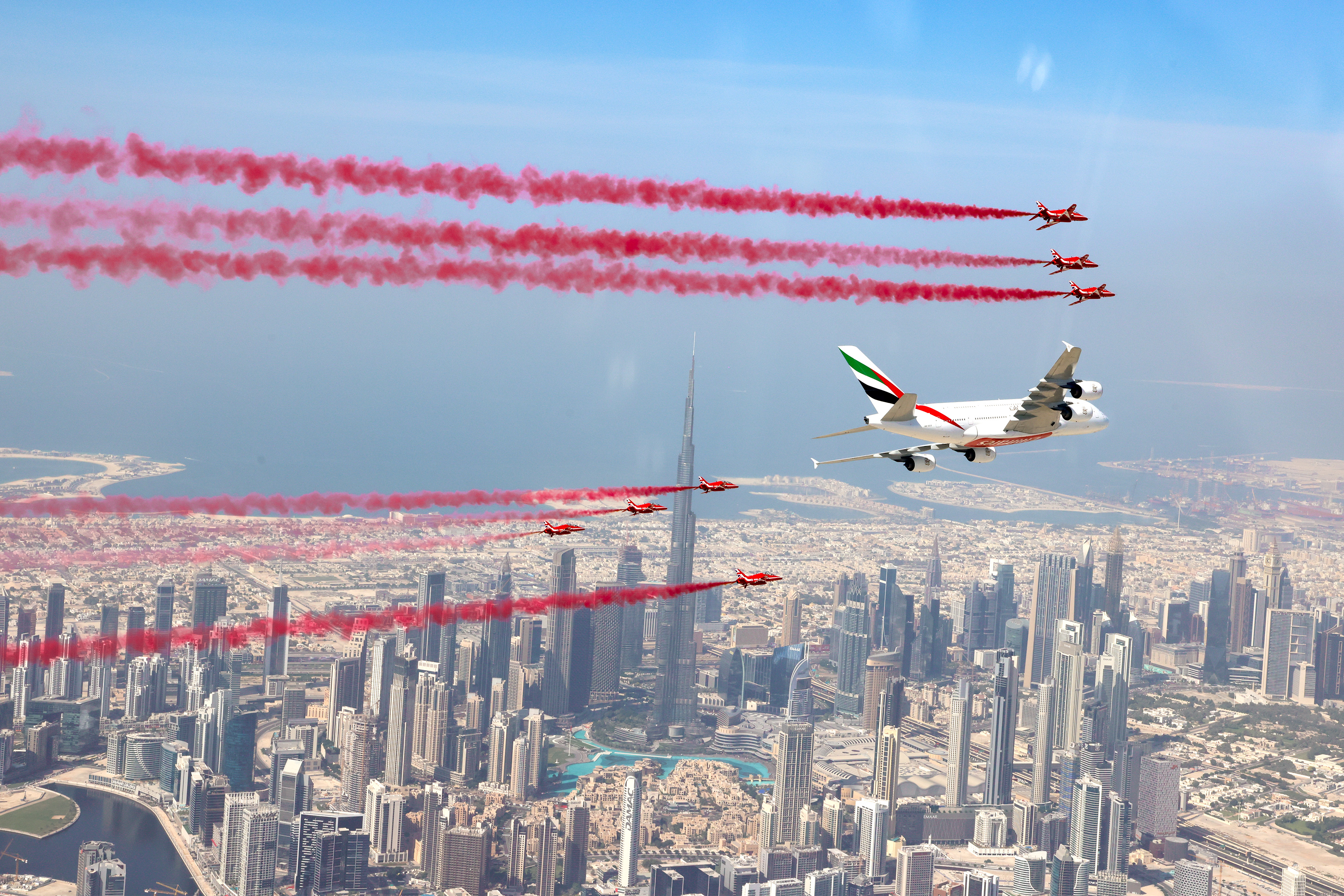 The Red Arrows fly with an Airbus A380 airliner over Dubai in 2022.