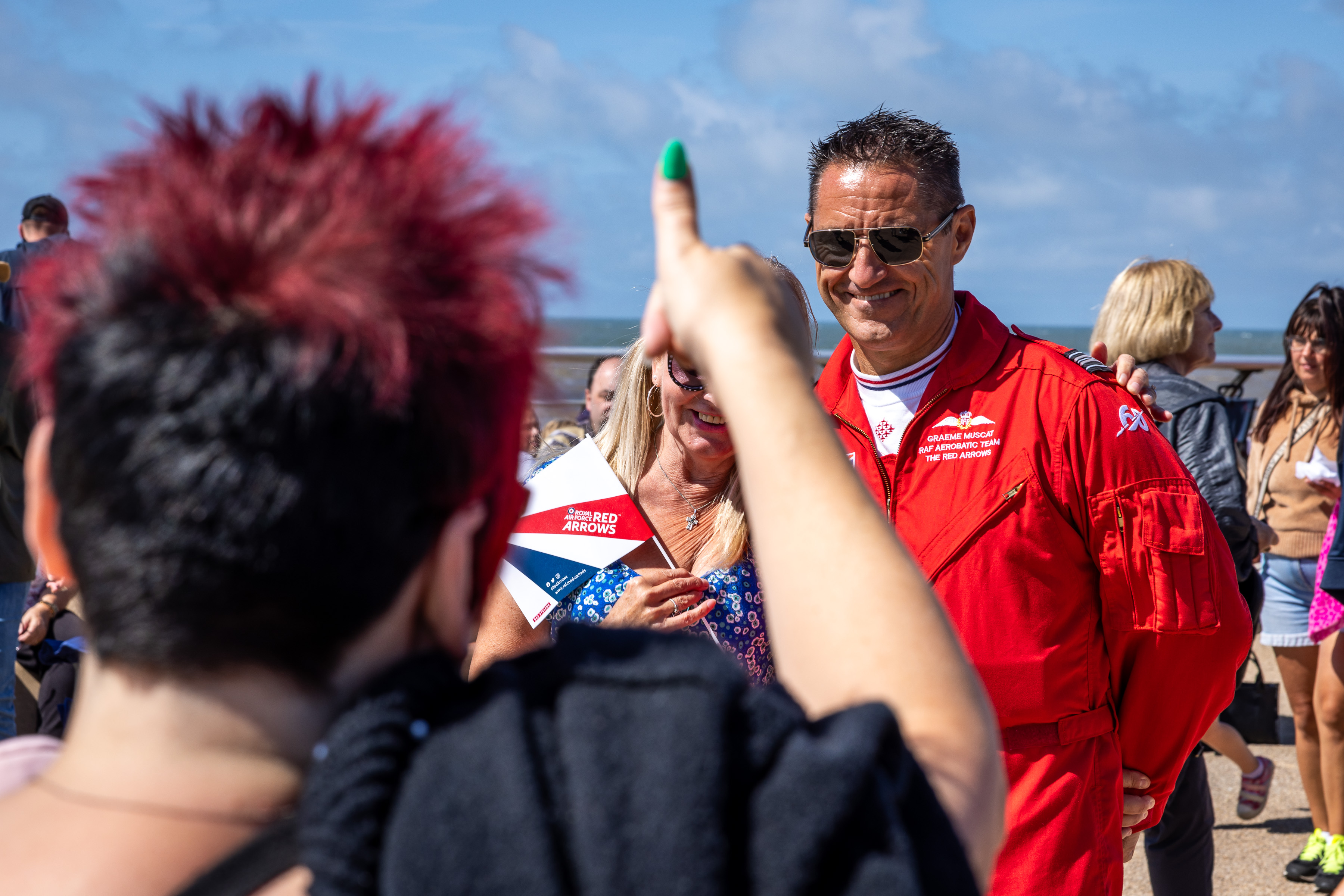 Red 10 meets people at an airshow.