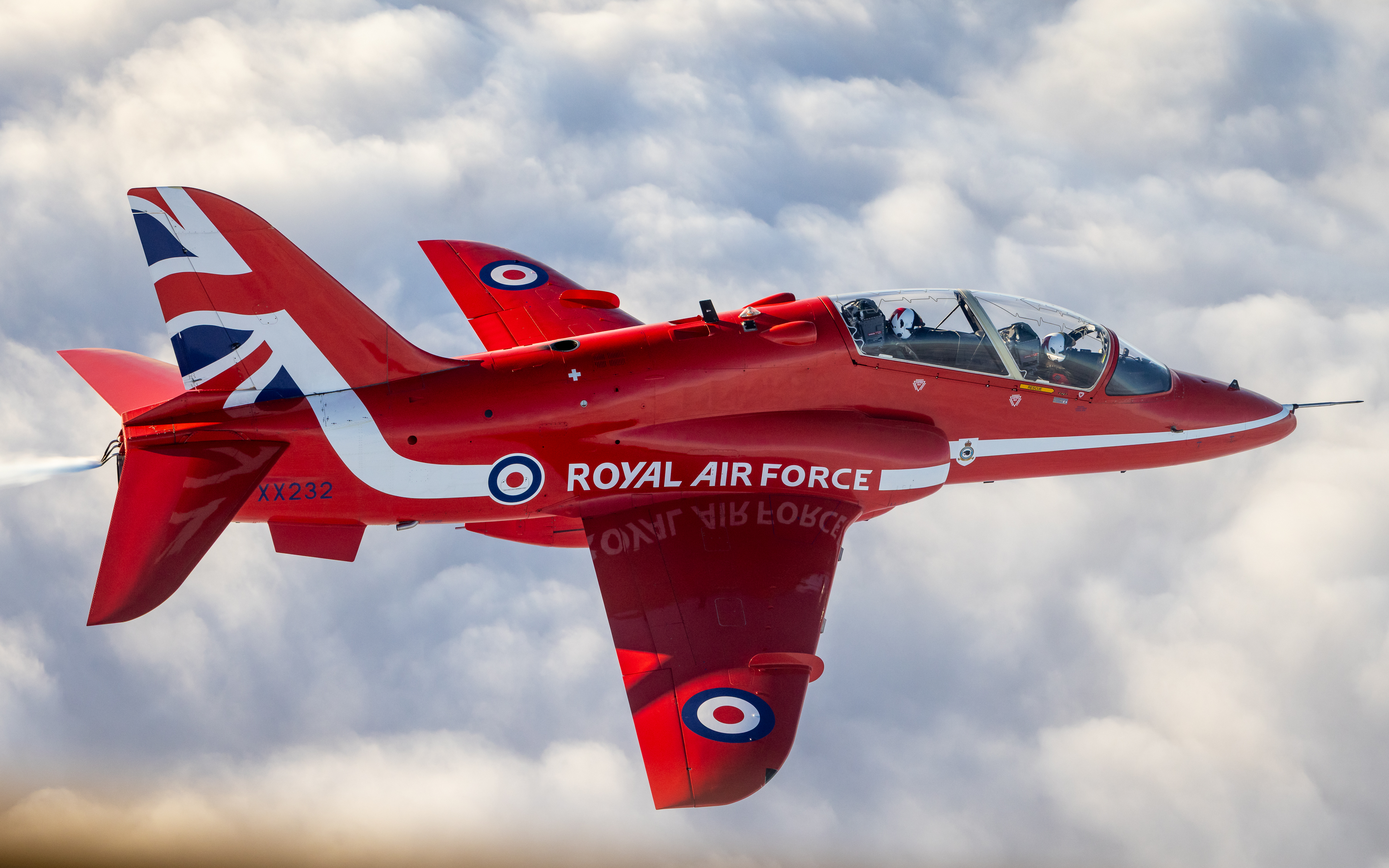 A Red Arrows Hawk jet is seen flying above clouds in Lincolnshire.