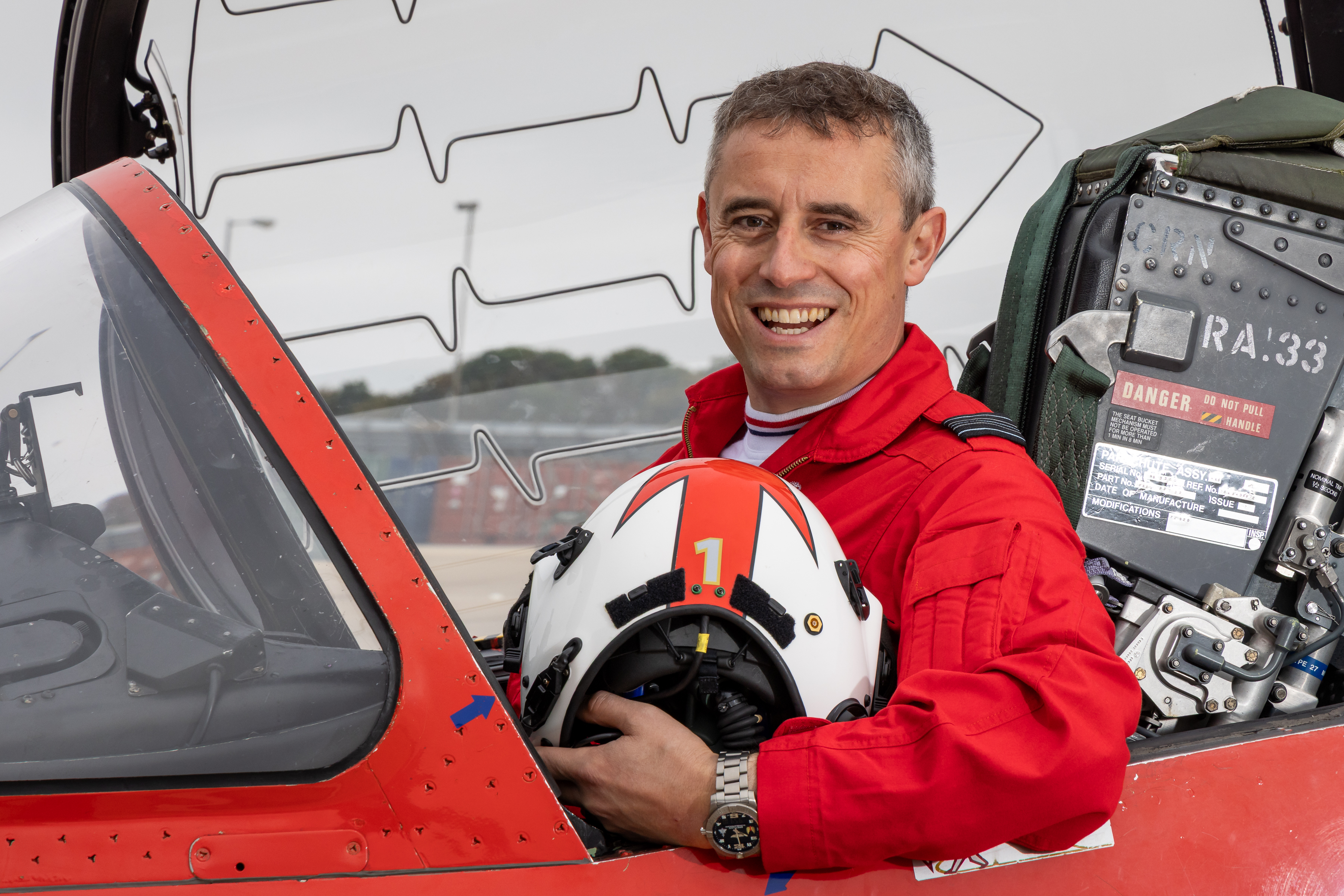 Squadron Leader James Turner, the new Red 1, sits in a Red Arrows Hawk cockpit.