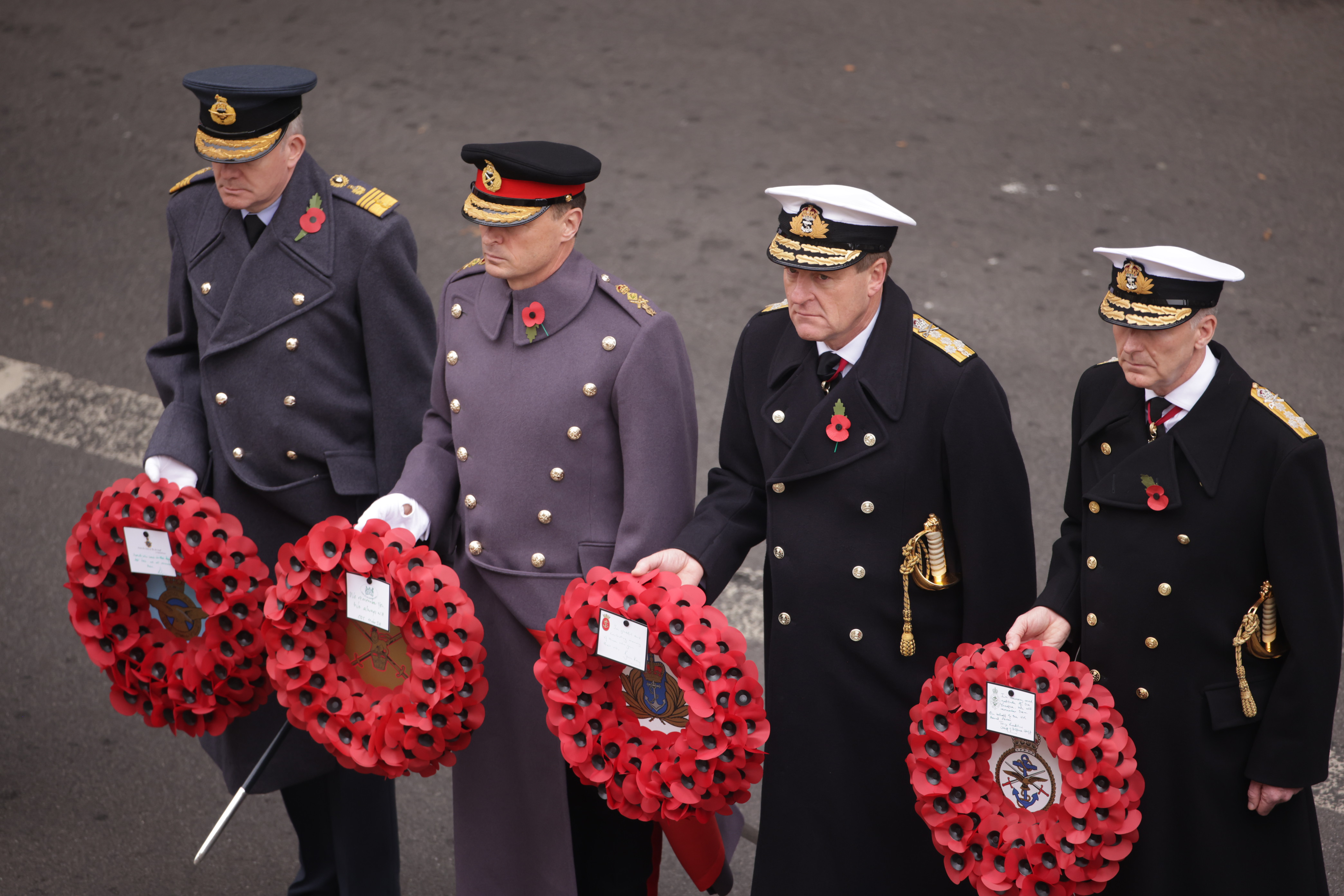 Chiefs from the Royal Navy, British Army and Royal Air Force with the Chief of the Defence Staff holding wreaths at the Cenotaph.