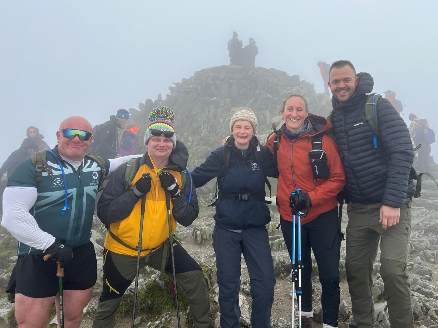 Hikers stand for group photo.