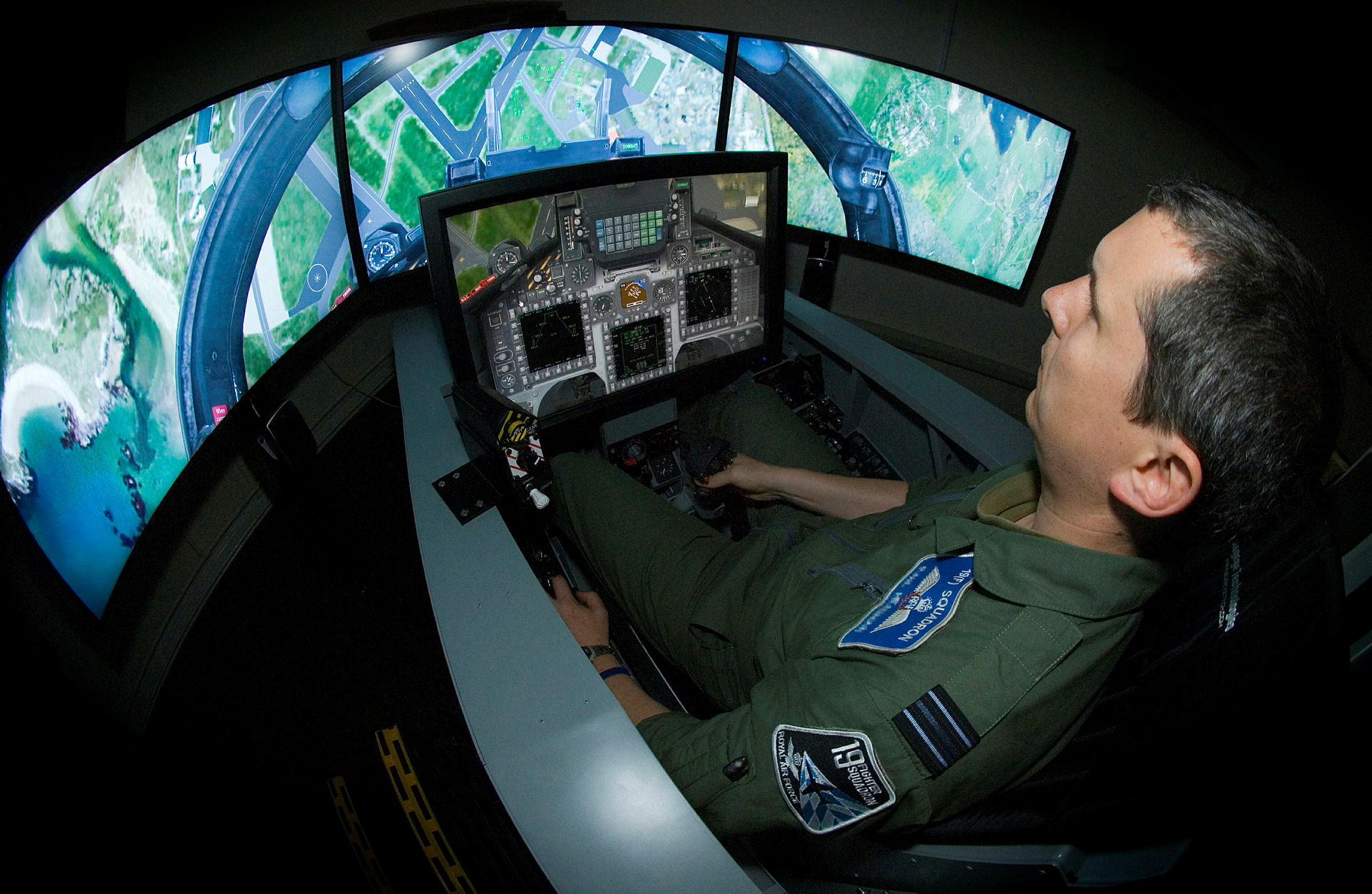 A member of the RAF operating simulation training equipment at RAF Valley.