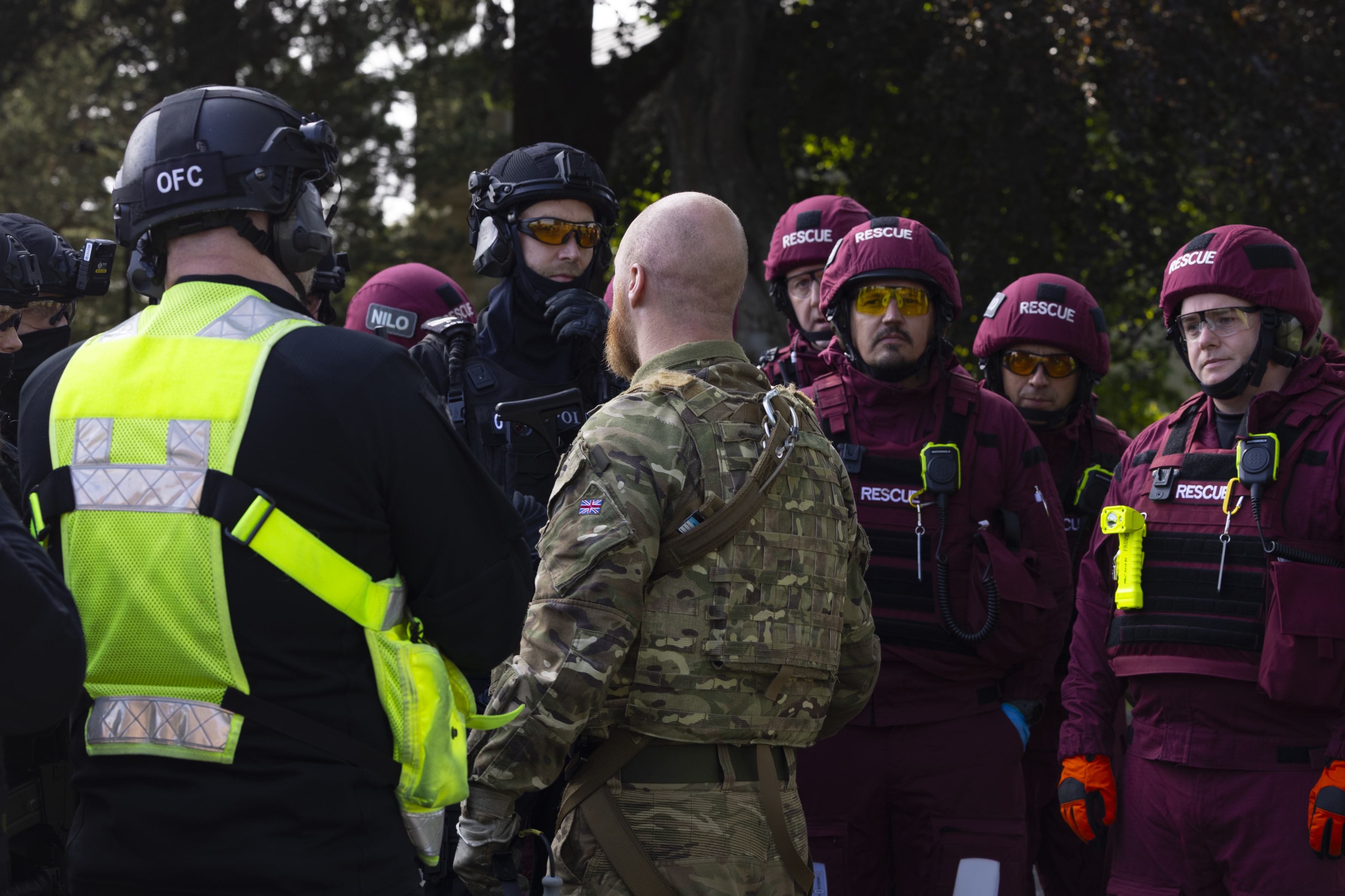 Assorted personnel gathered for a briefing before a sortie as part of Exercise Tartan Kukri.