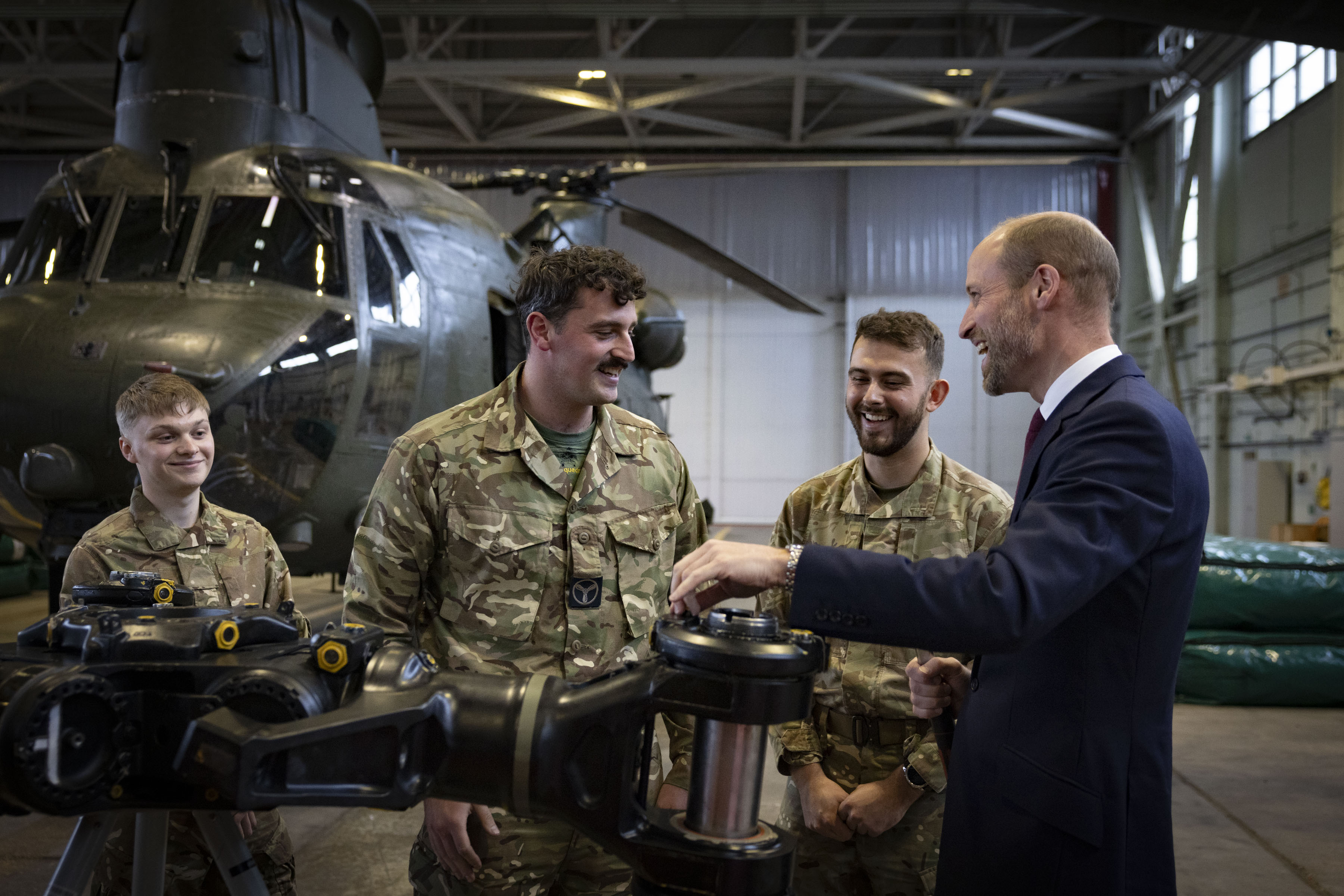Prince William Talks to personnel over a rotor head