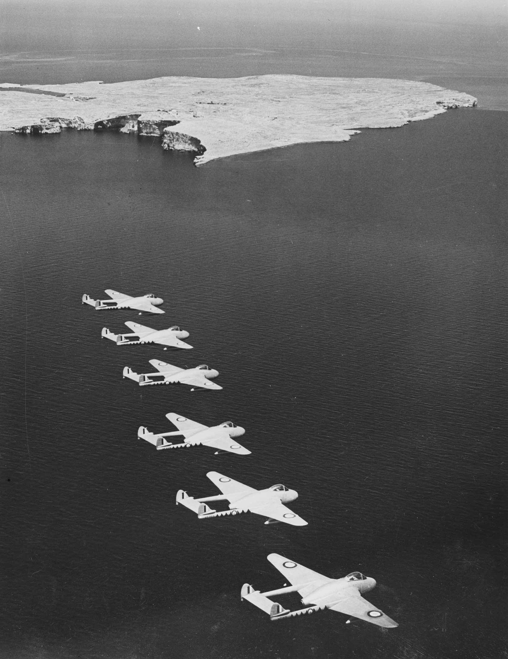 Six Vampire aircraft in black and white.