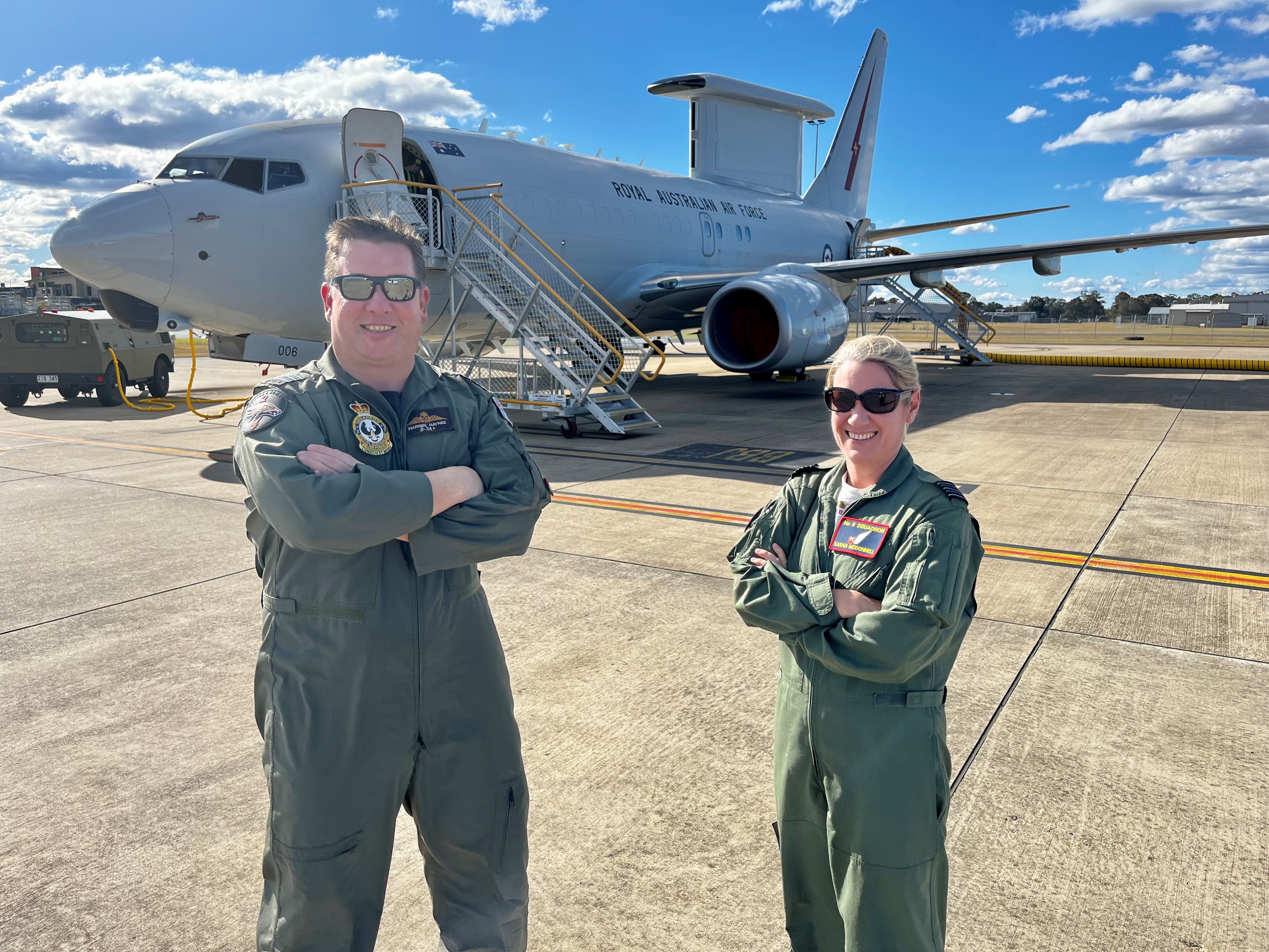 2 pilots stood in front of the Wedgetail aircraft.